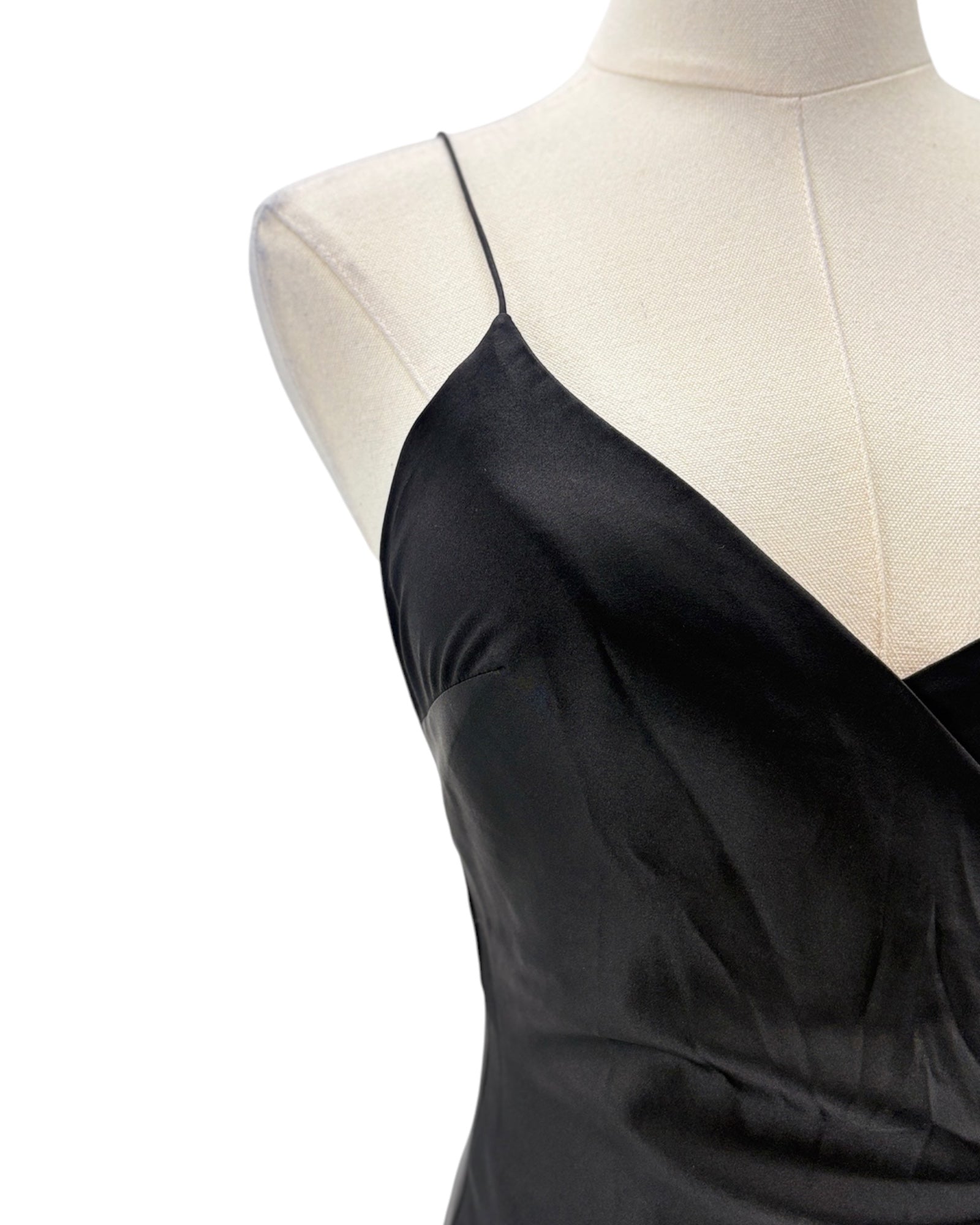 Black dress on a mannequin with a white background