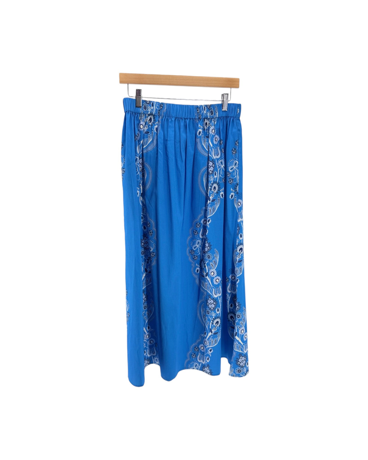 Bright blue midi skirt with a black and white bandana print down the front and sides on a white background