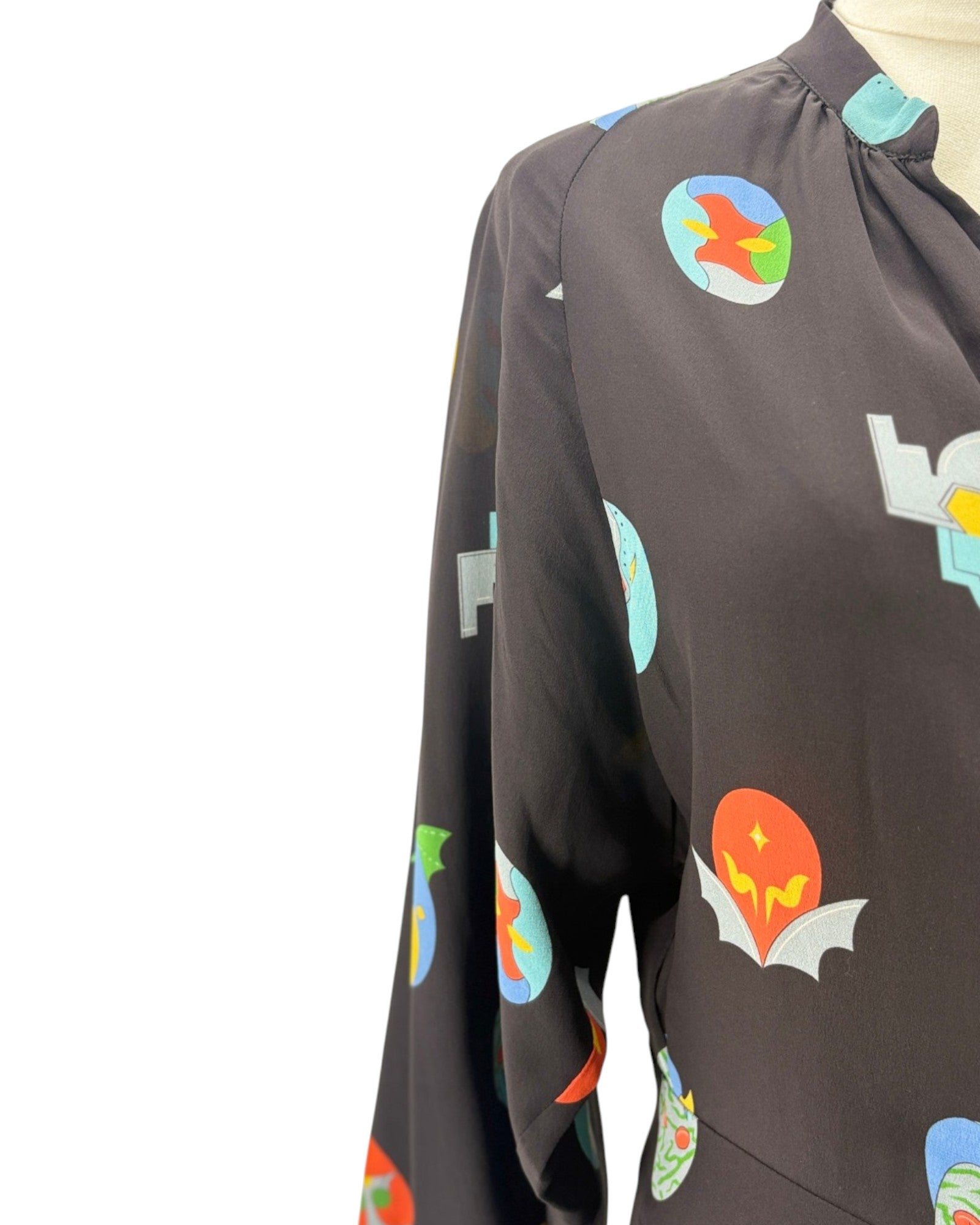 Black jumpsuit with colorful graphic designs on a white background