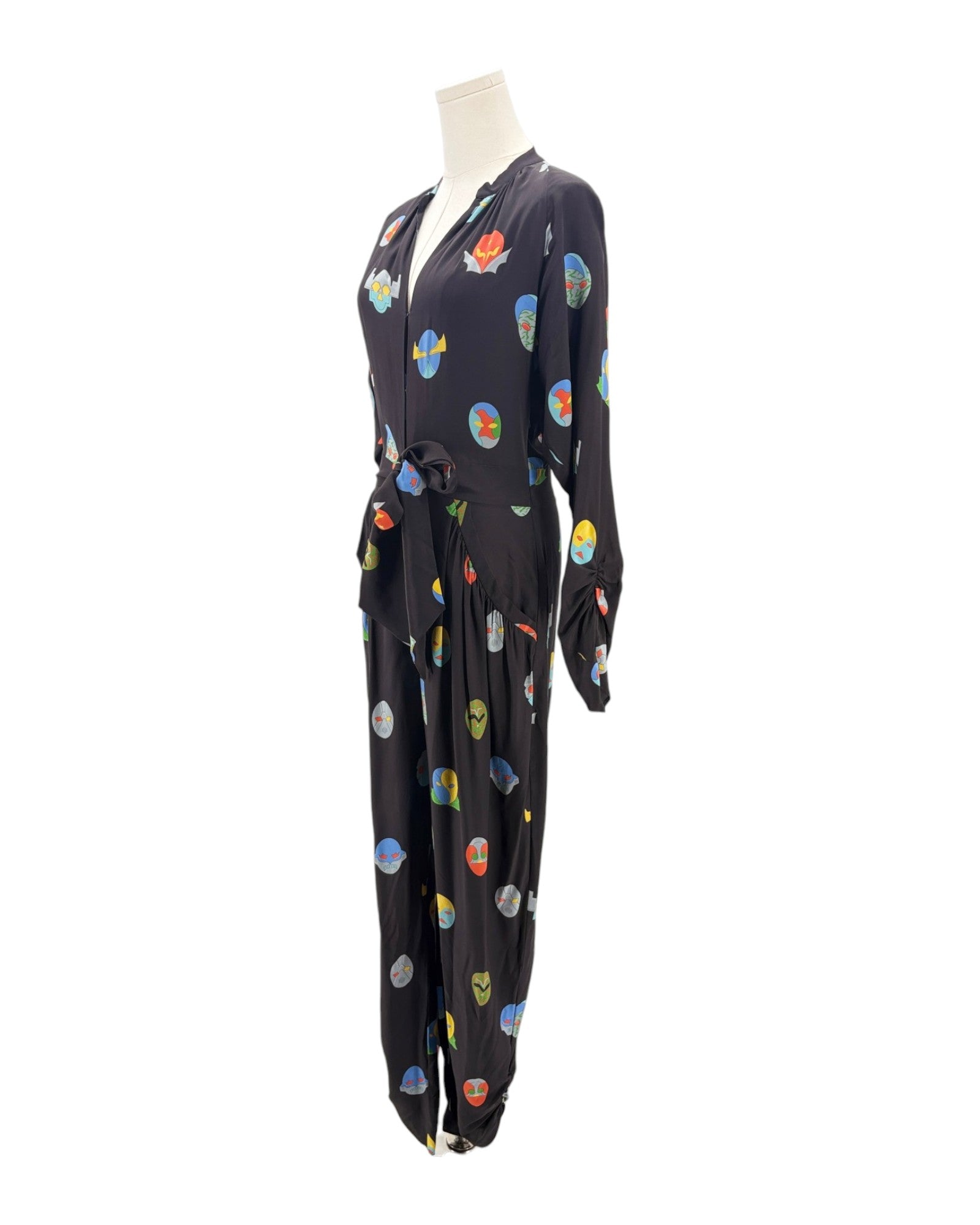 Black jumpsuit with colorful abstract patterns on a mannequin against a white background