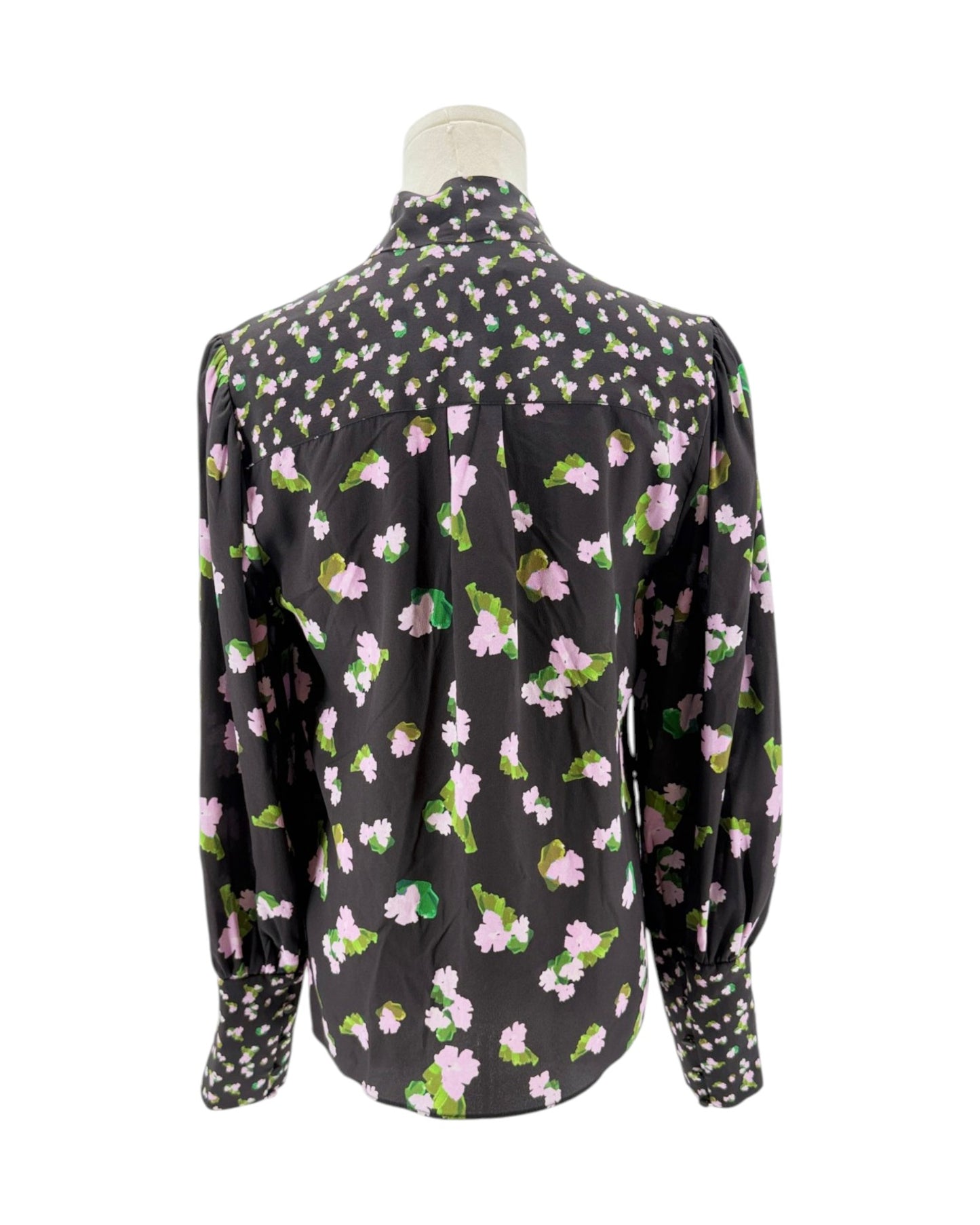 Floral patterned blouse on a mannequin against a white background