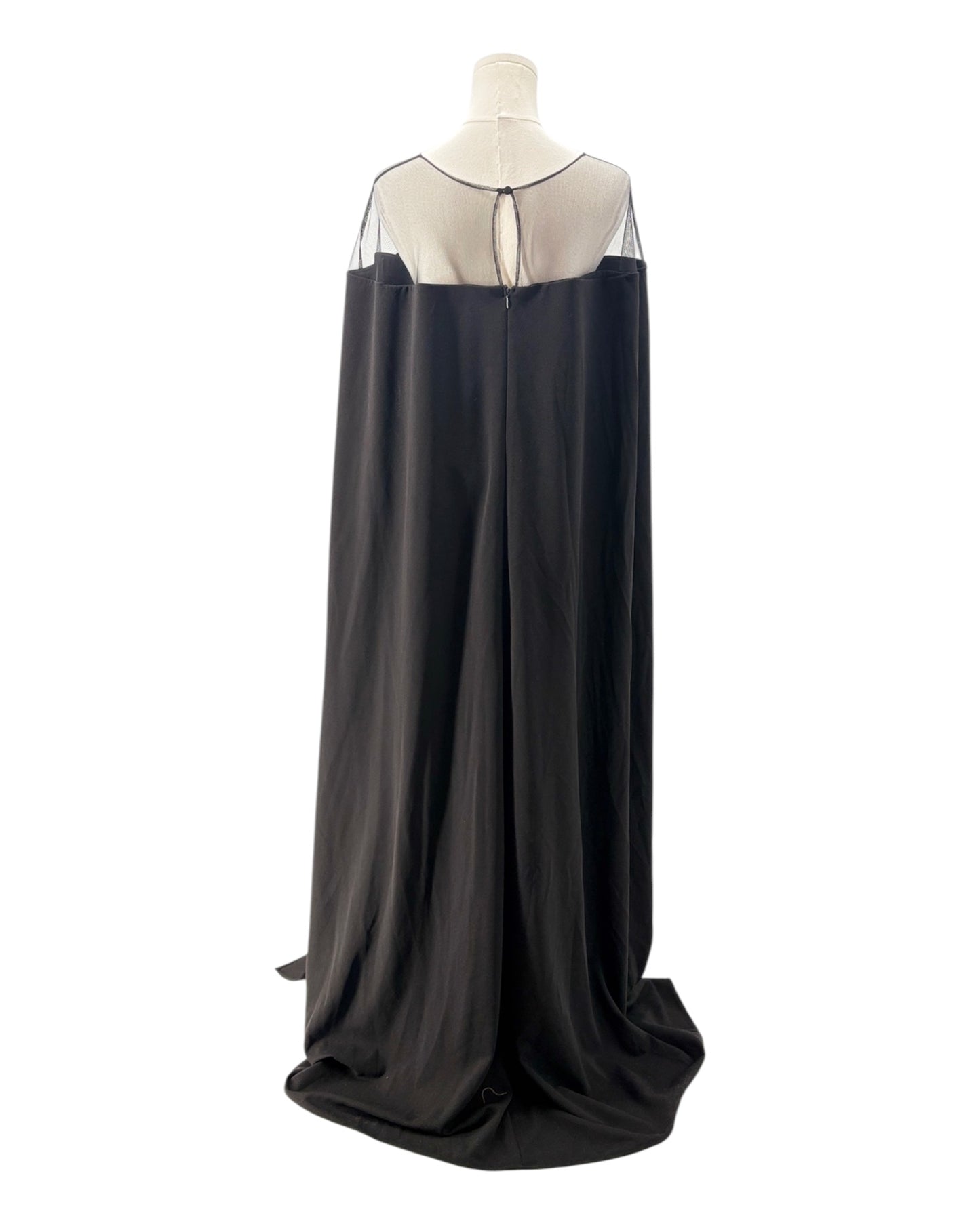 Black evening gown with sheer neckline on a mannequin against a white background