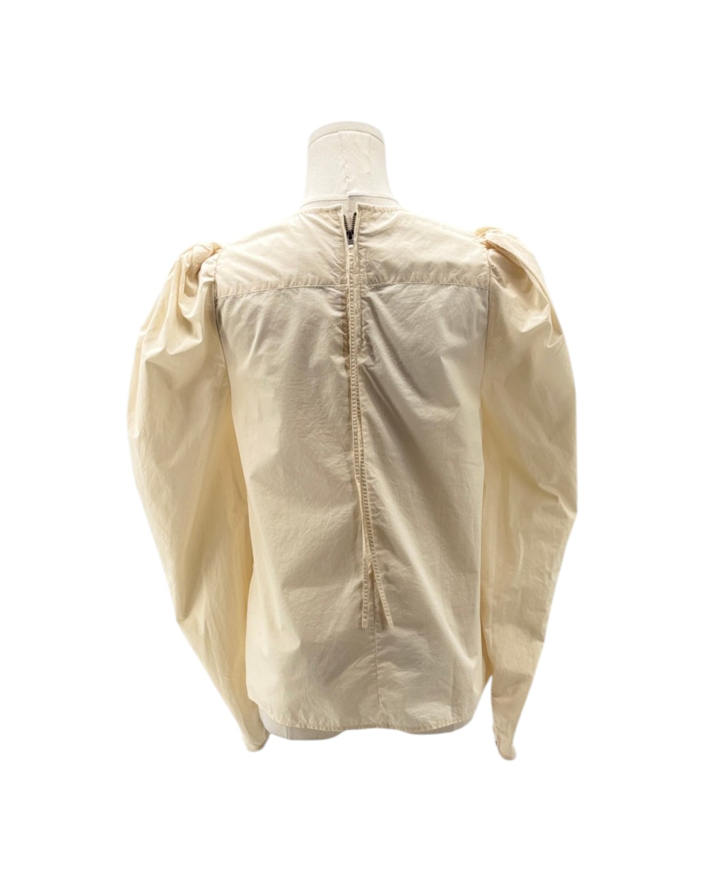 Beige shirt on a mannequin with a white background