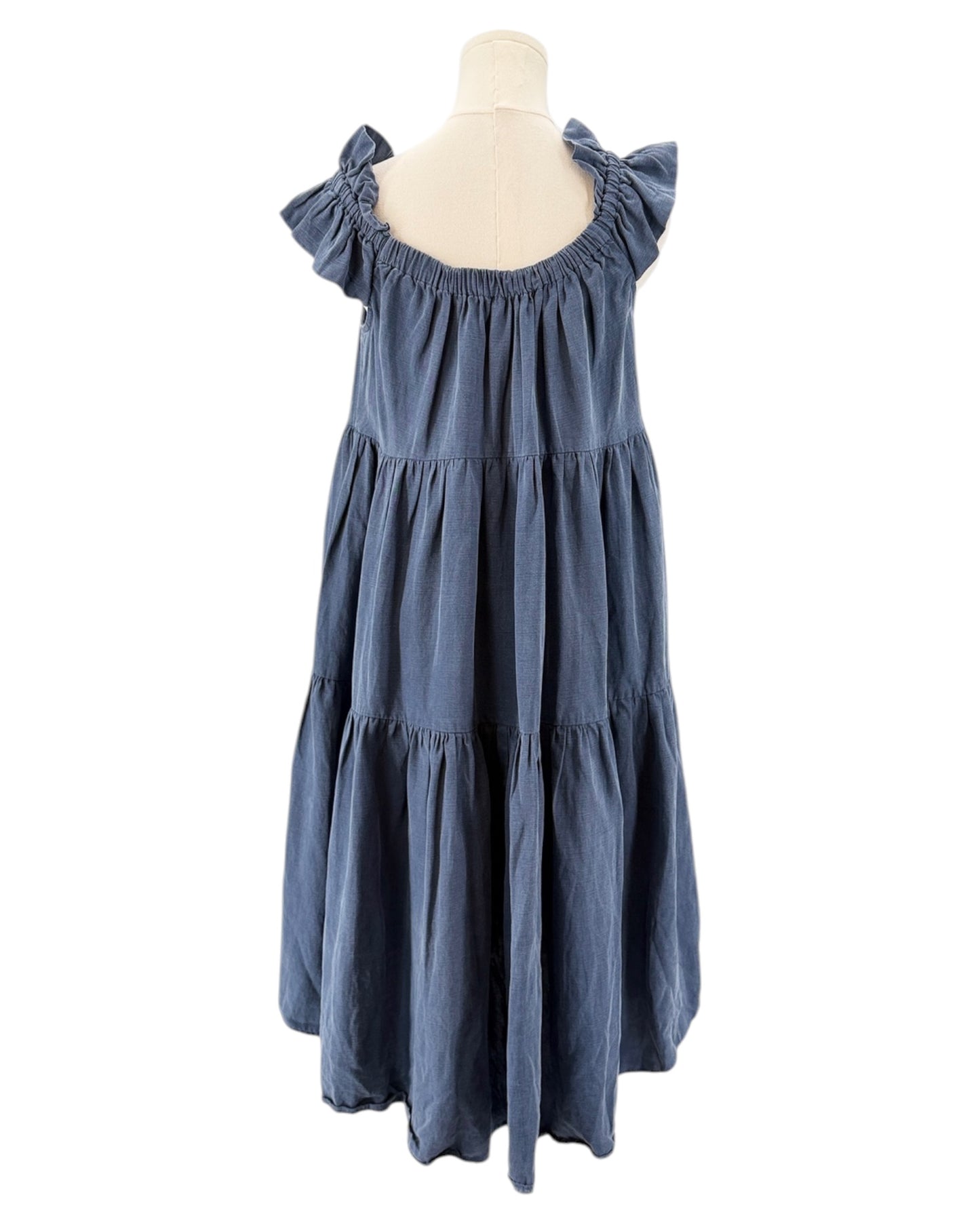 Blue dress on a mannequin against a white background