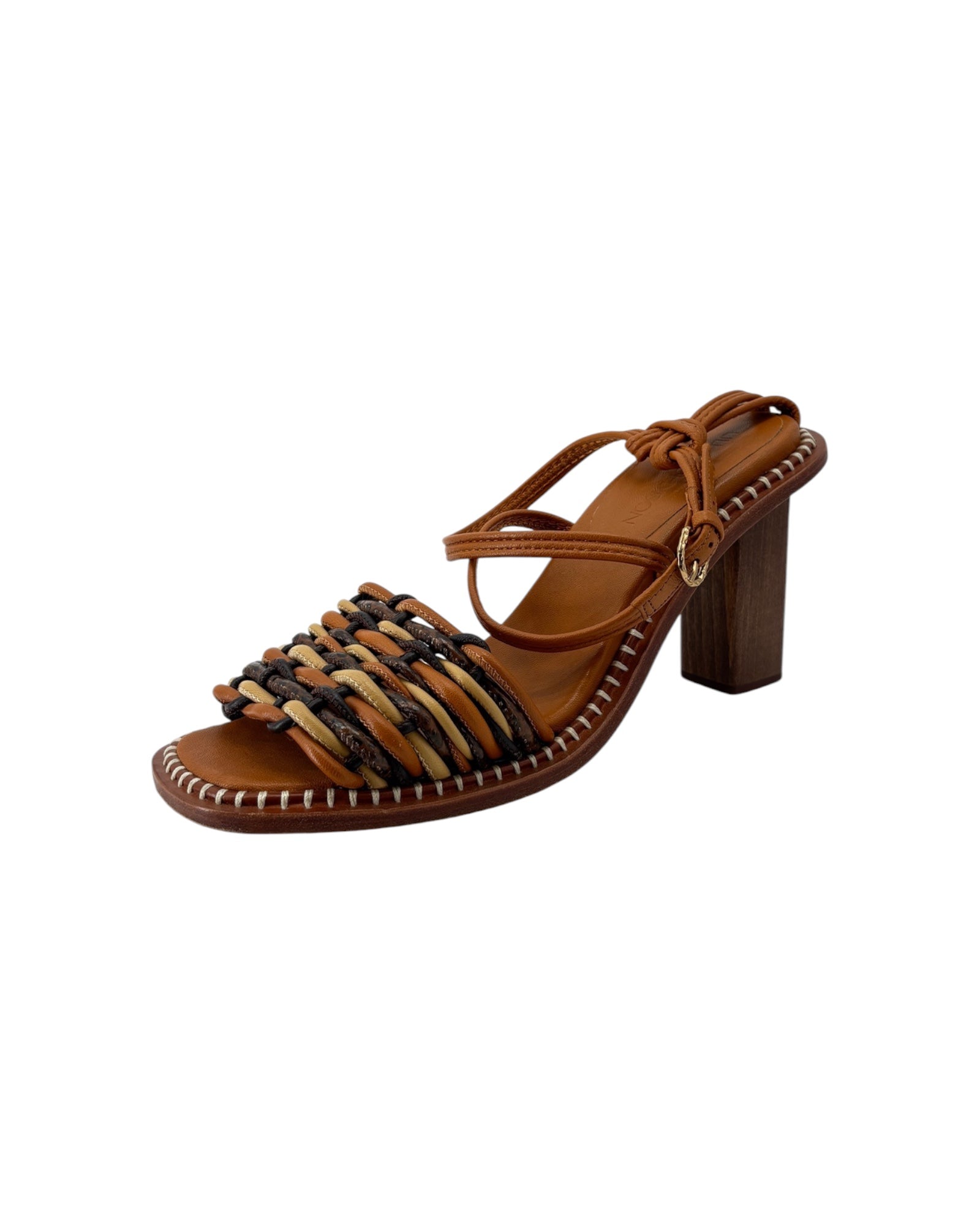 Brown sandal with woven design on a white background