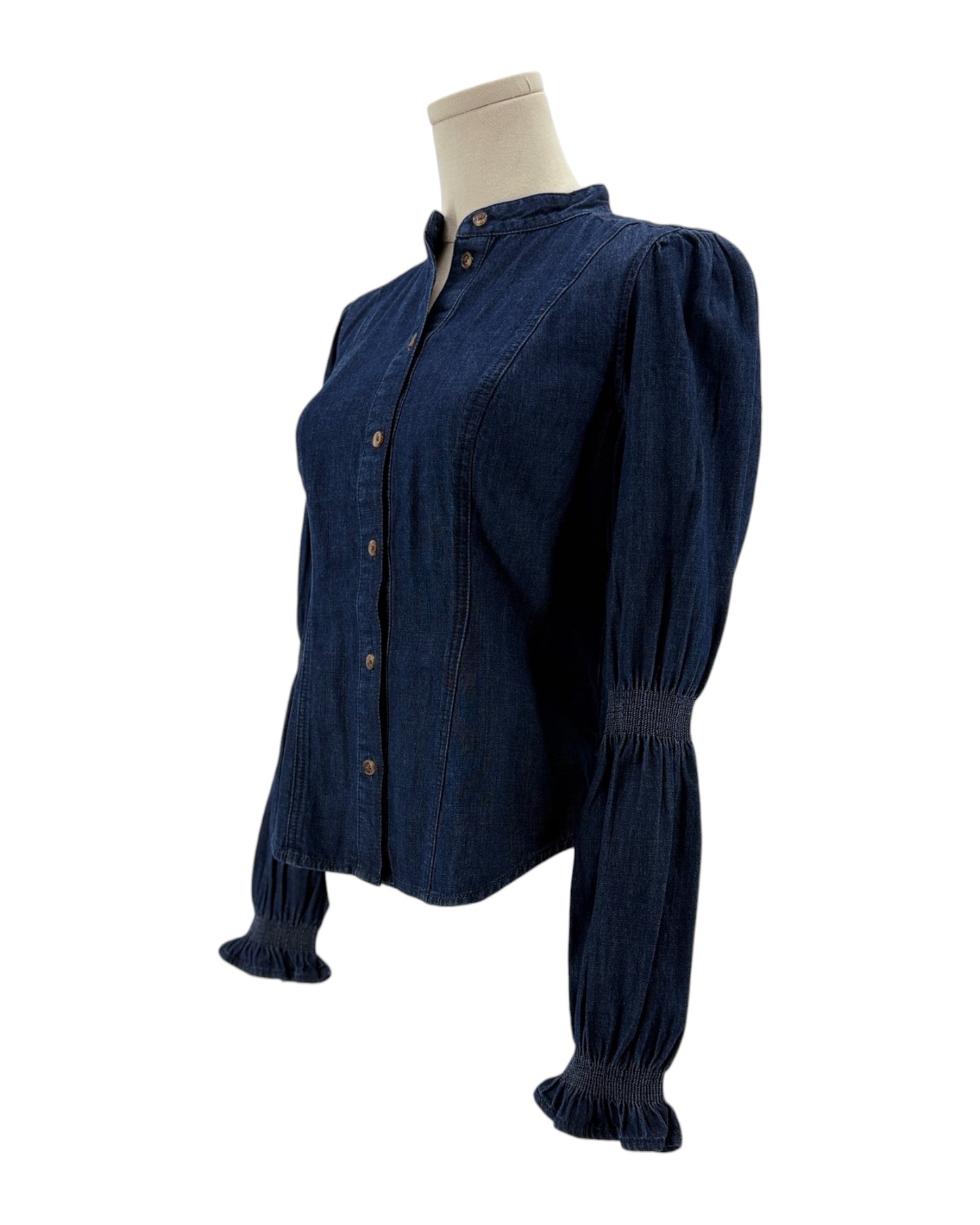 Navy blue blouse on a mannequin against a white background