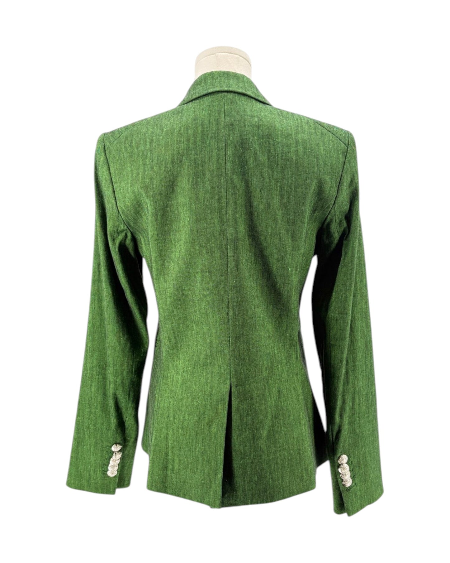 Green blazer on a mannequin against a white background
