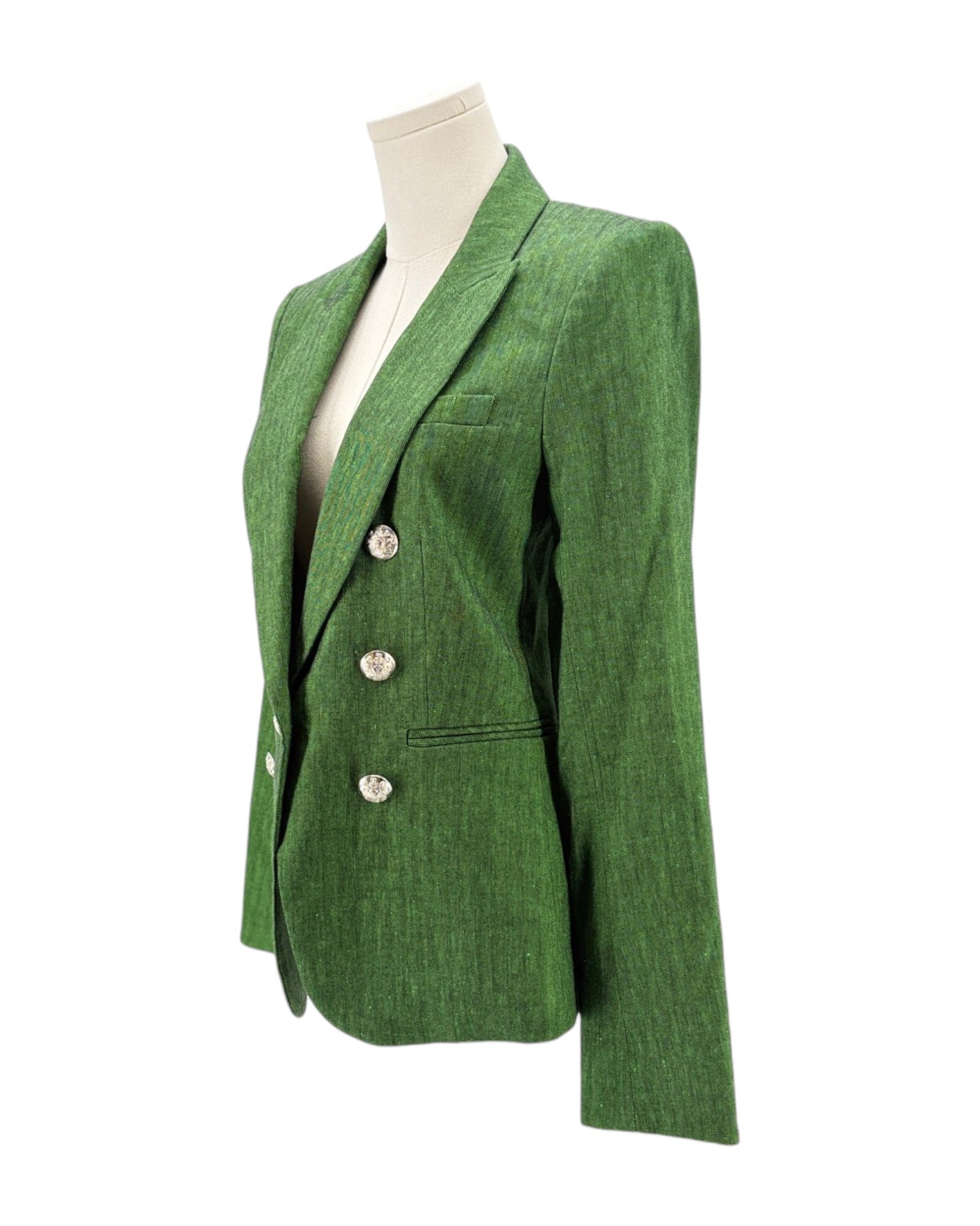 Green blazer on a mannequin against a white background