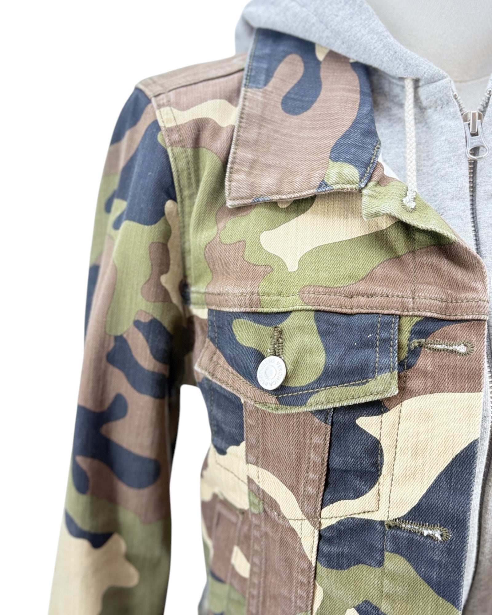 Camouflage jacket with a gray hoodie on a white background