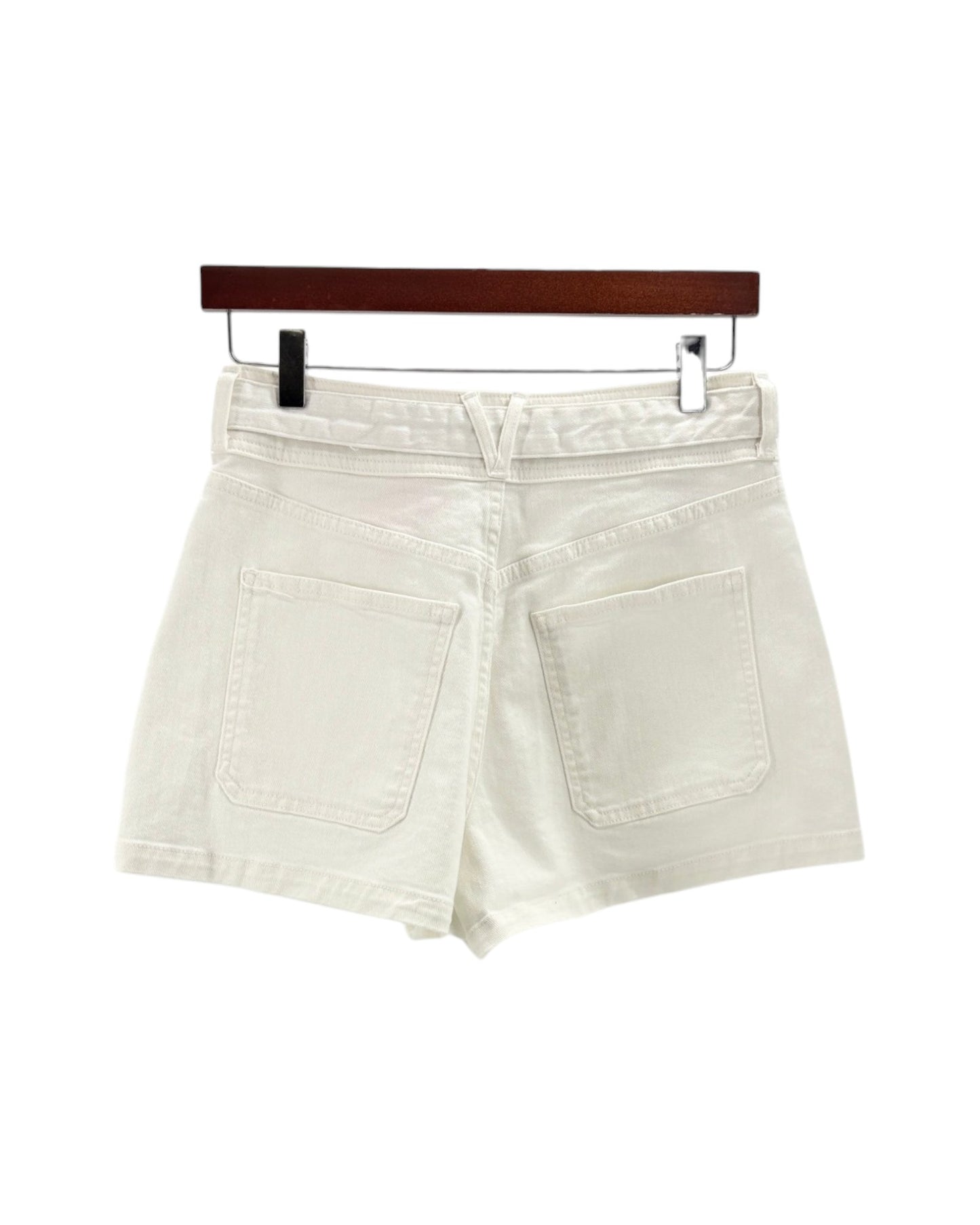 White shorts on a hanger against a white background