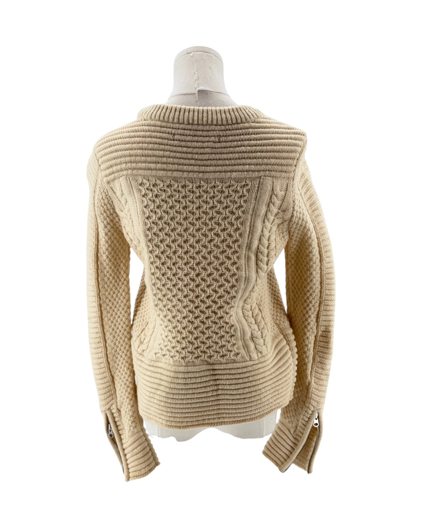Beige knitted sweater on a mannequin against a white background