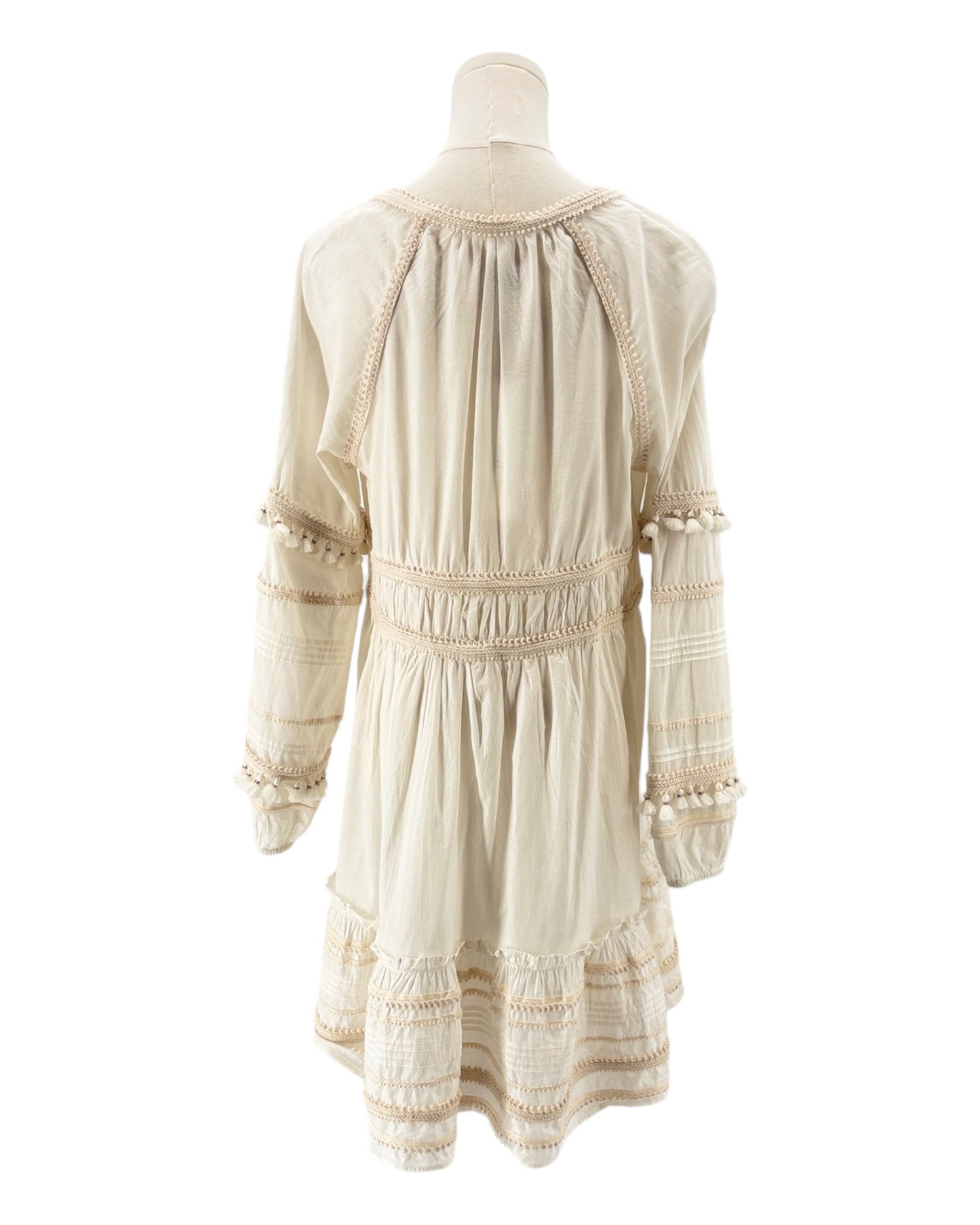 Veronica Beard cream dress on a mannequin against a white background