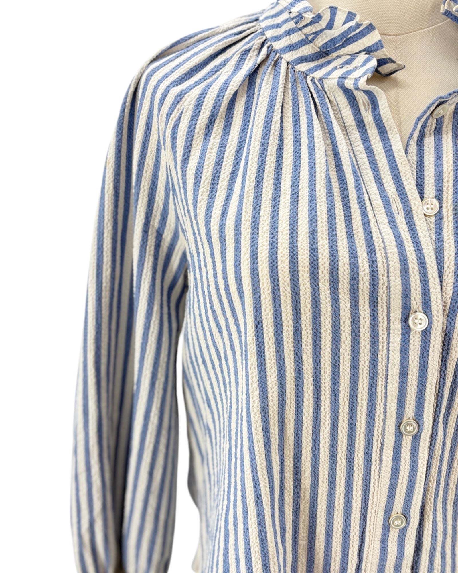 Veronica Beard blue and white striped shirt on a mannequin with a white background