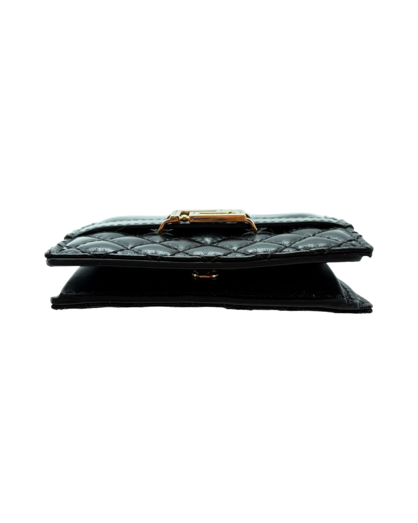 Black quilted wallet with gold clasp on a white background
