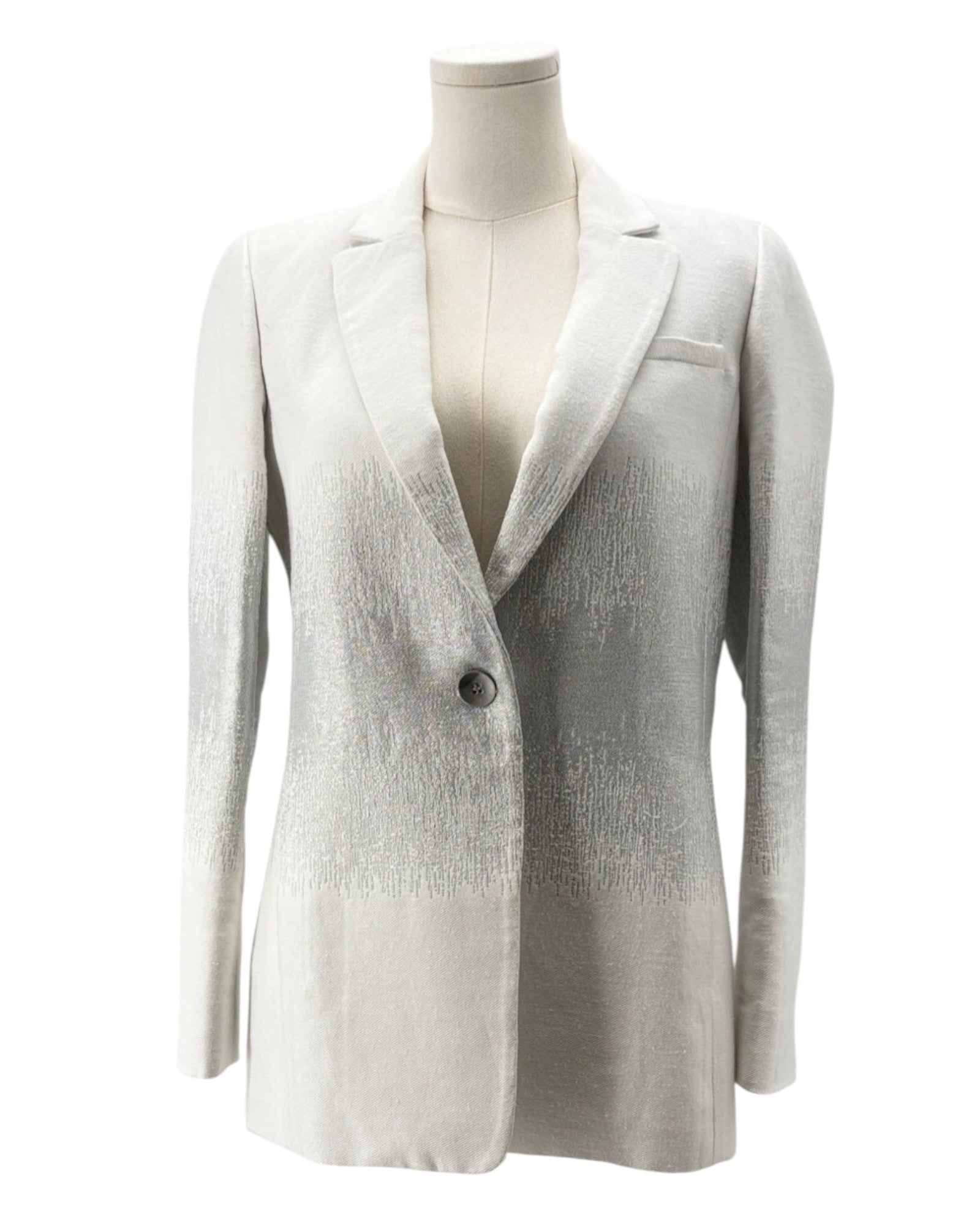 White blazer on a mannequin against a white background
