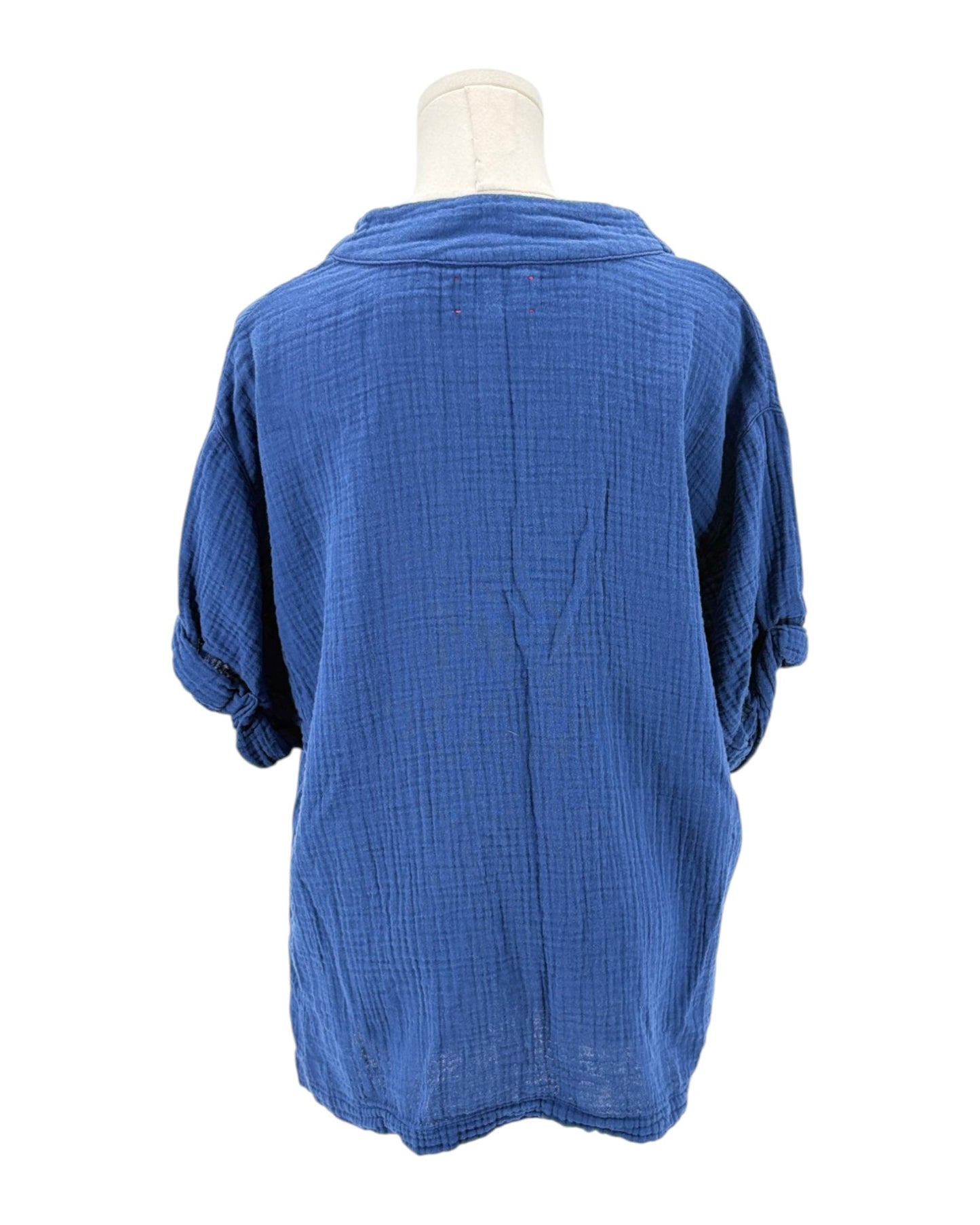 Blue textured shirt on a mannequin against a white background
