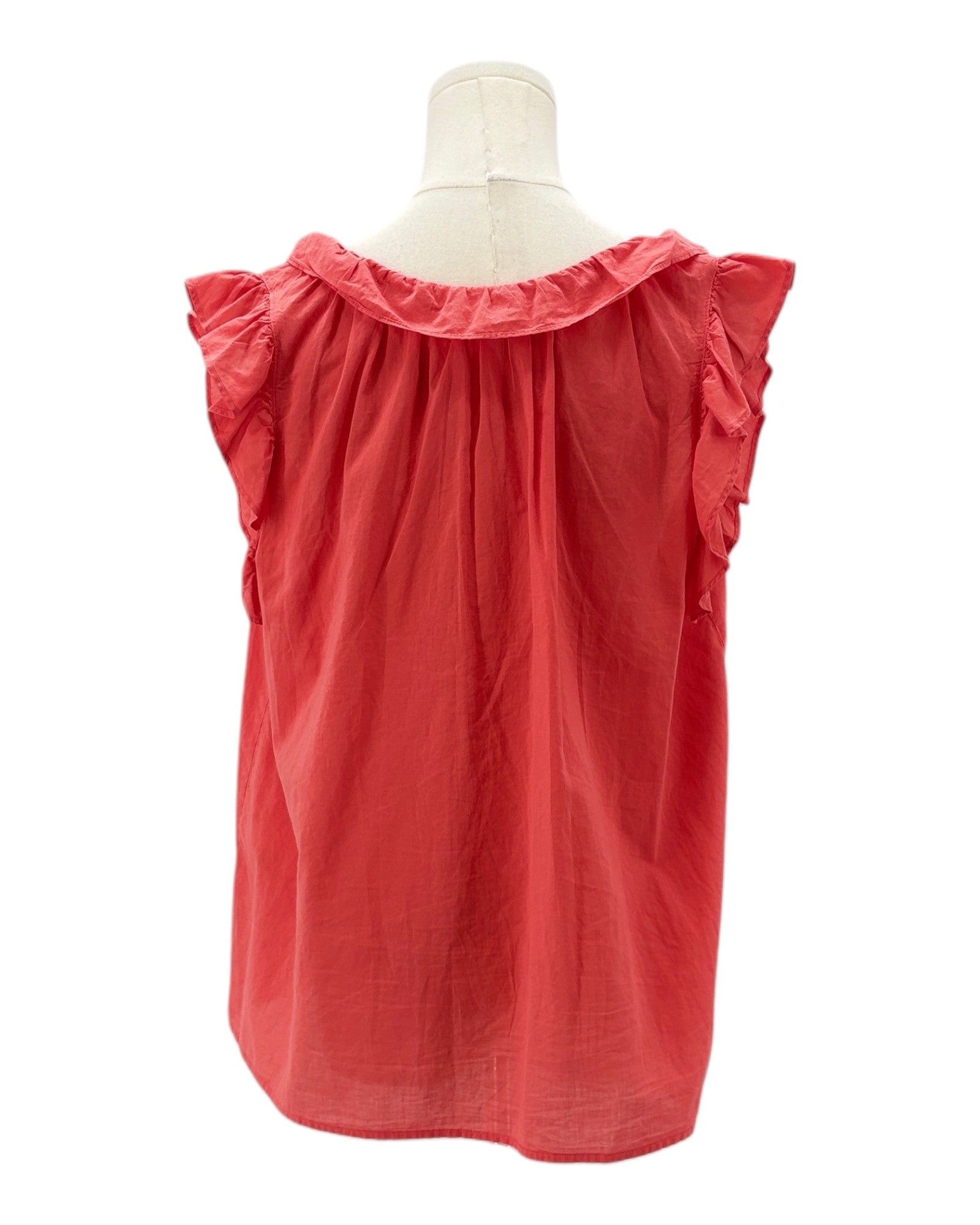 Coral sleeveless top on a mannequin with a white background