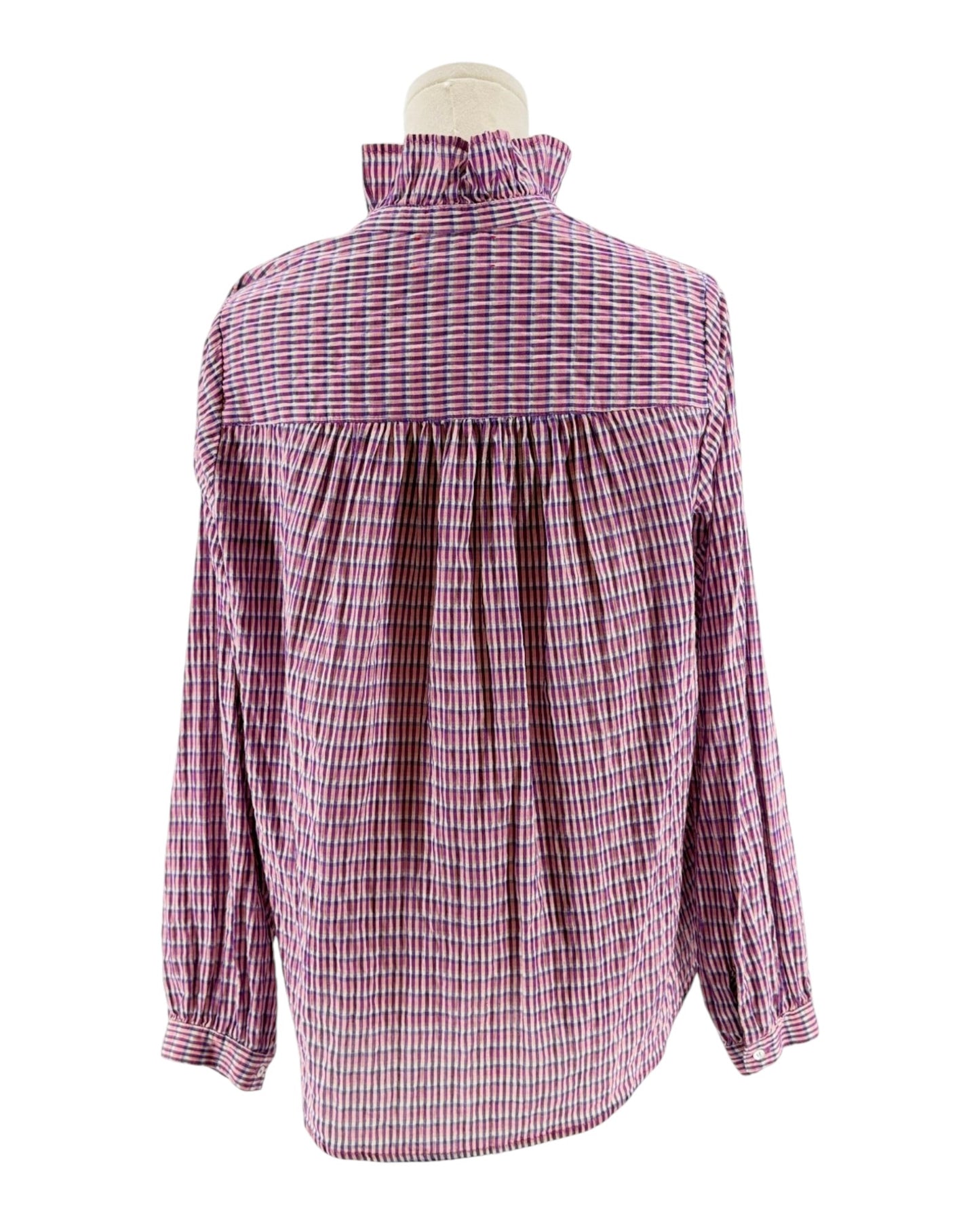 Pink and white checkered blouse on a mannequin against a white background