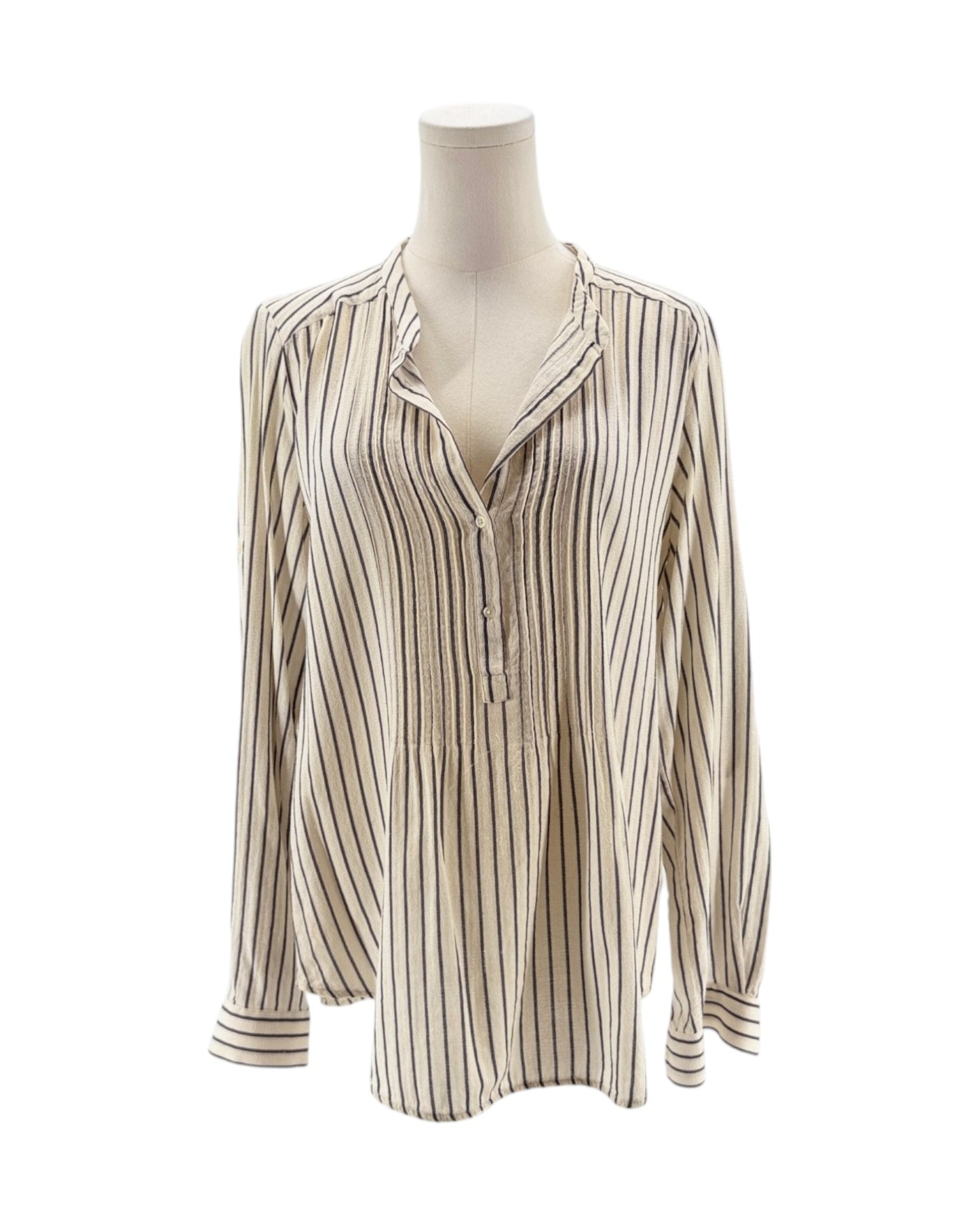 Striped shirt on a mannequin against a white background