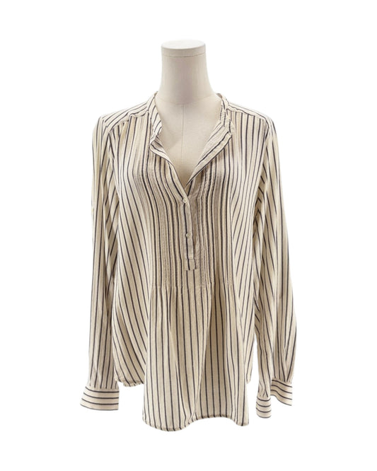 Striped shirt on a mannequin against a white background