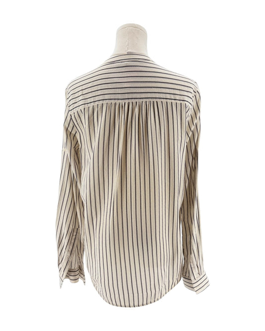Striped shirt on a mannequin against a white background