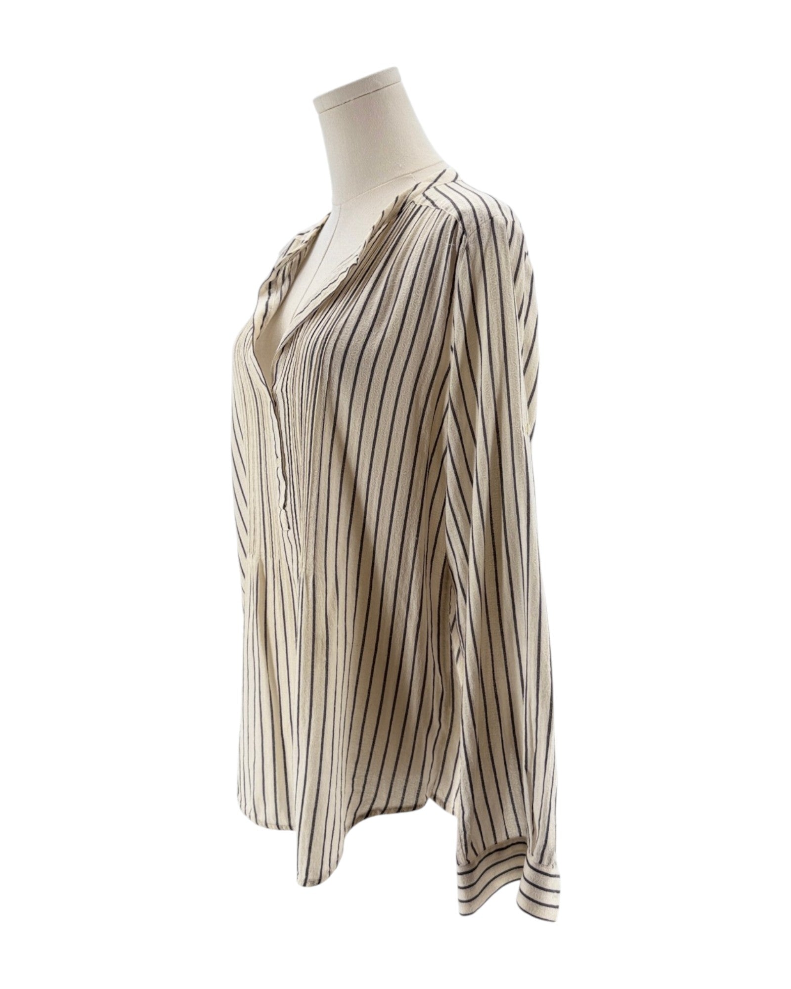 Striped blouse on a mannequin against a white background