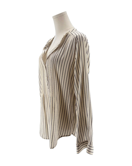 Striped blouse on a mannequin against a white background