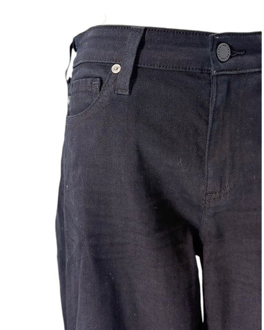 Close-up of black pants on a white background