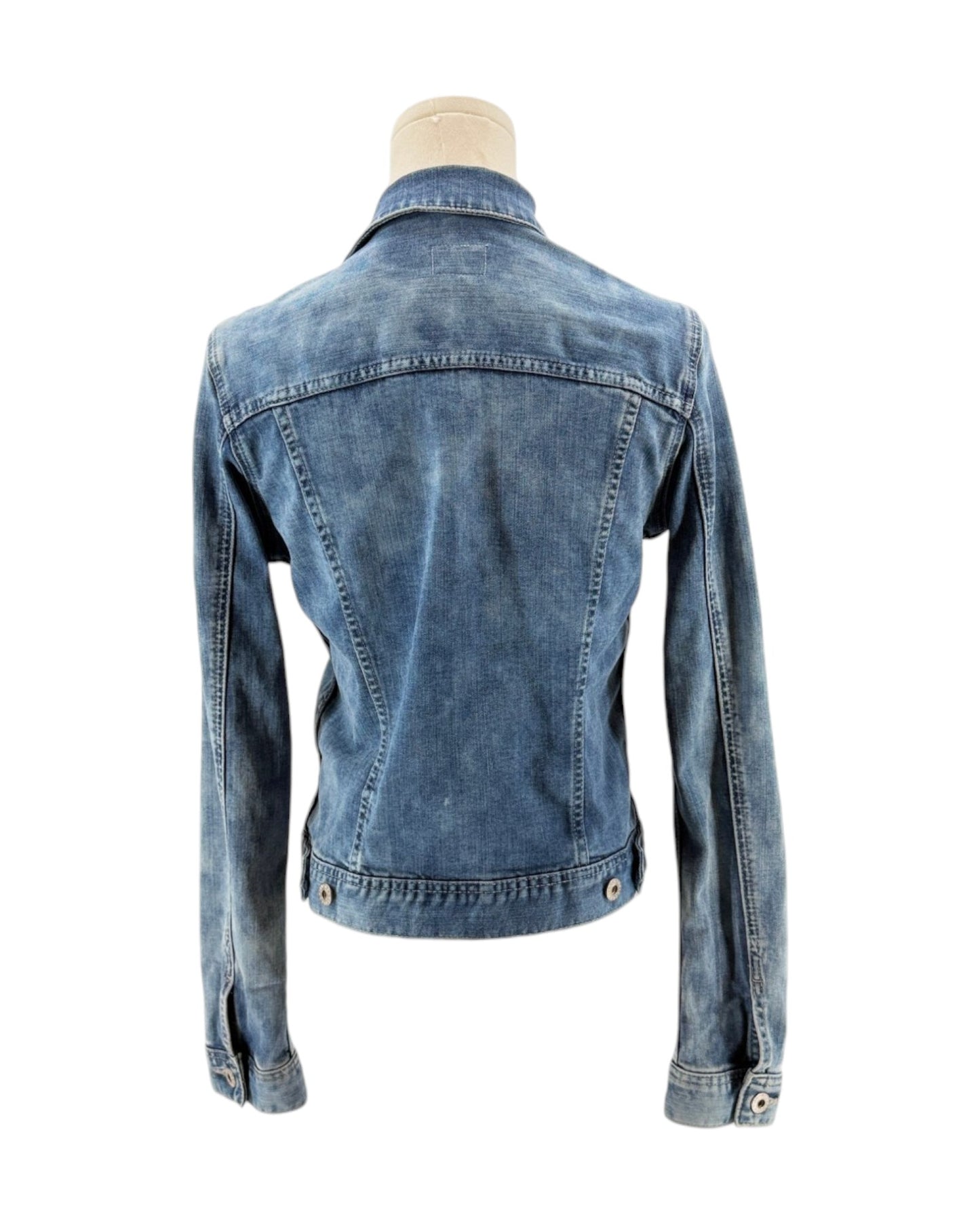 Blue denim jacket on a mannequin against a white background