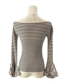 Black and white striped top on a mannequin against a white background