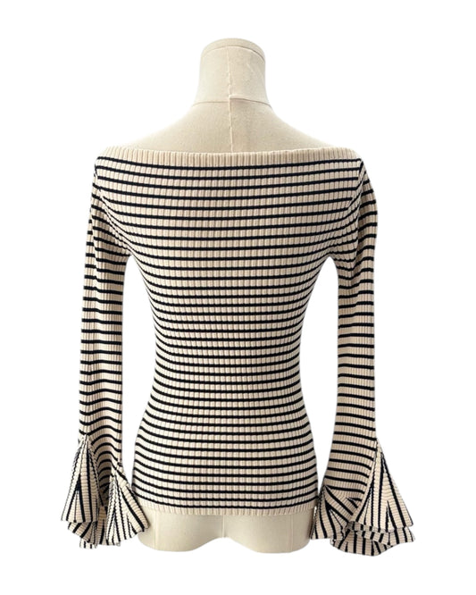 Black and white striped top on a mannequin against a white background