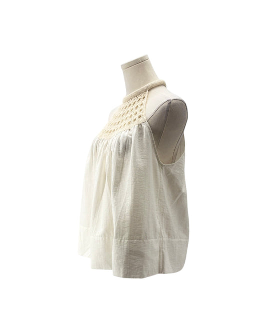 An off-white sleeveless blouse with a textured crochet yoke, displayed on a dress form mannequin against a white background.