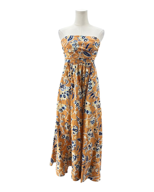 Yellow strapless dress with floral pattern on a white background