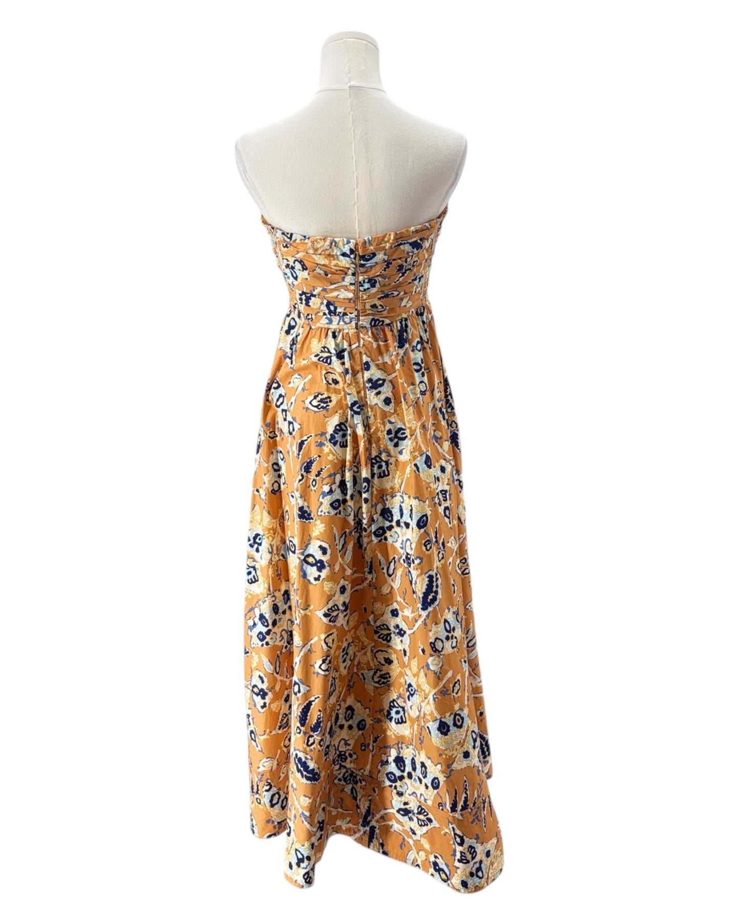 Floral dress on a mannequin against a white background