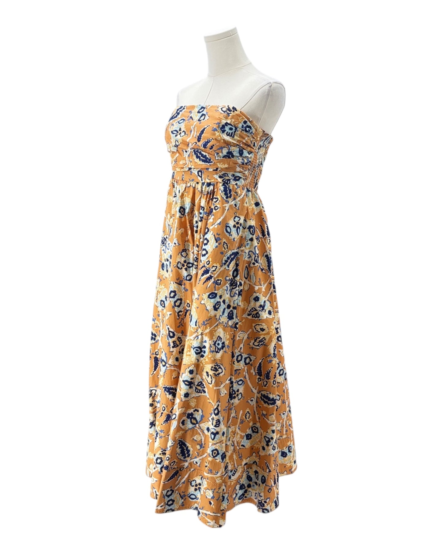 Floral dress on a mannequin against a white background