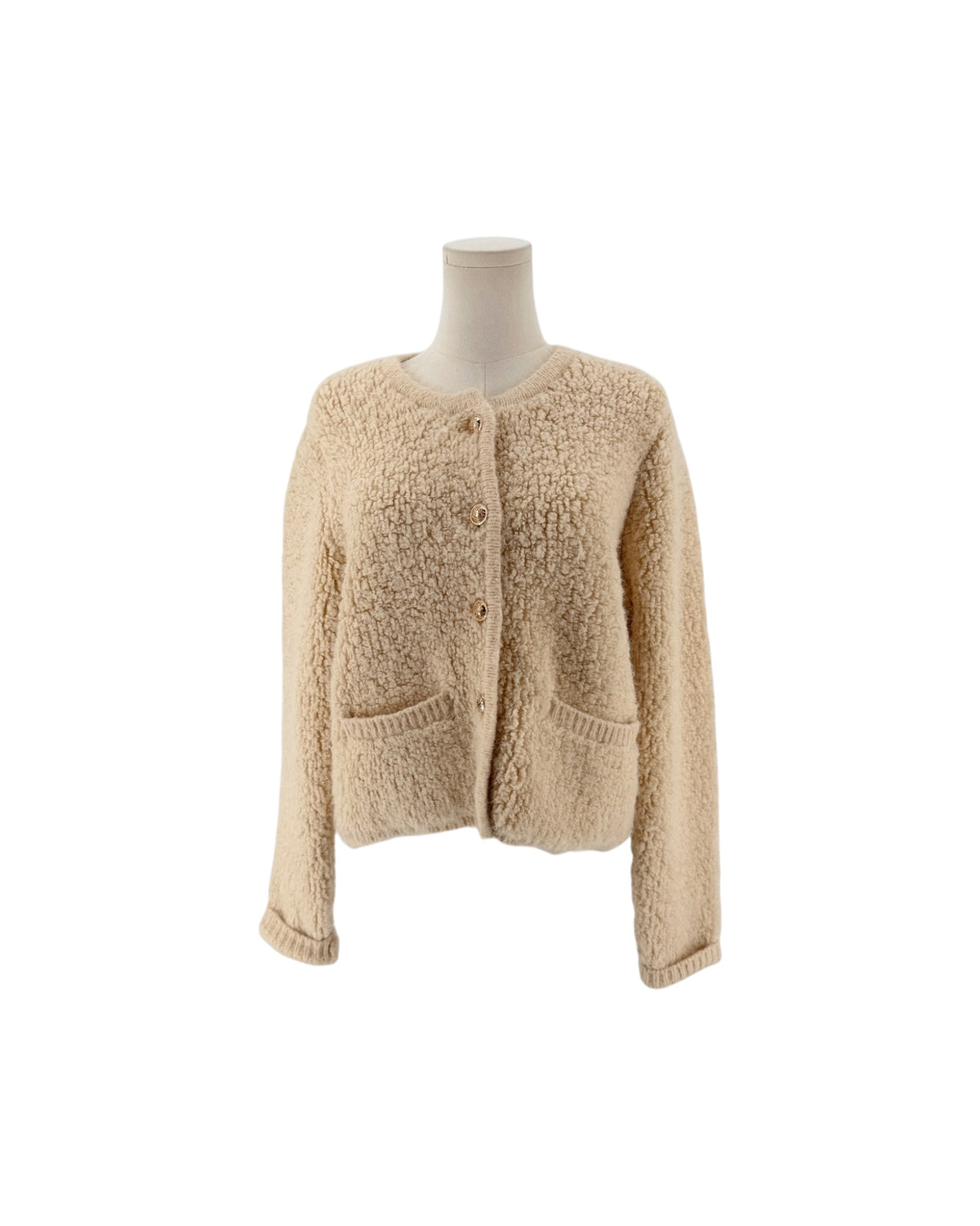 Beige Shaggy loop knit fabric, classic crewneck neckline, metallic button front closure, ribbed trim along the hem and cuffs, two front welt pockets cardigan on white background on a mannequin