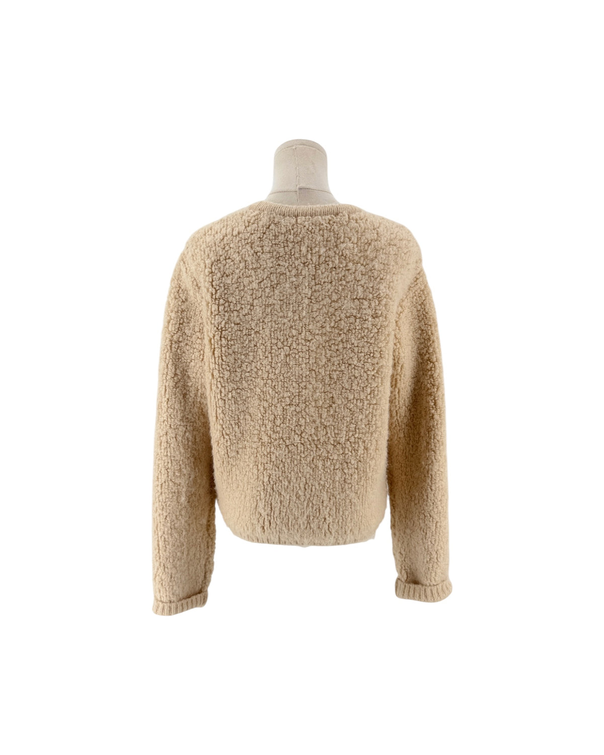 Beige Shaggy loop knit fabric, classic crewneck neckline, metallic button front closure, ribbed trim along the hem and cuffs, two front welt pockets cardigan on white background on a mannequin