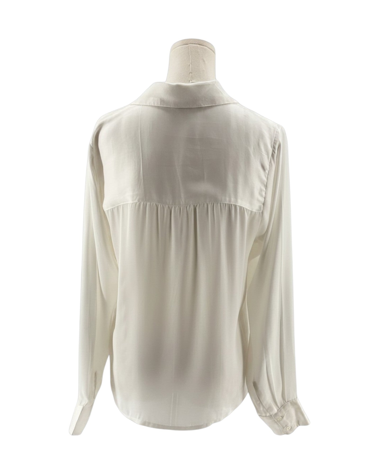 White blouse on a mannequin against a white background