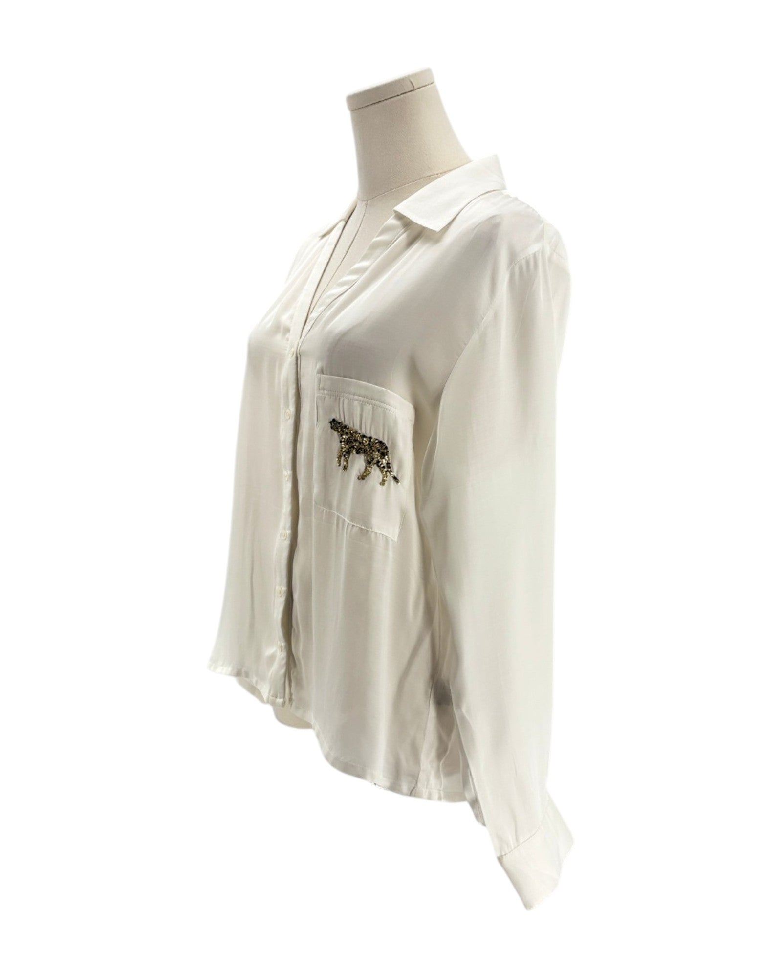 White shirt with a pocket design on a mannequin against a white background