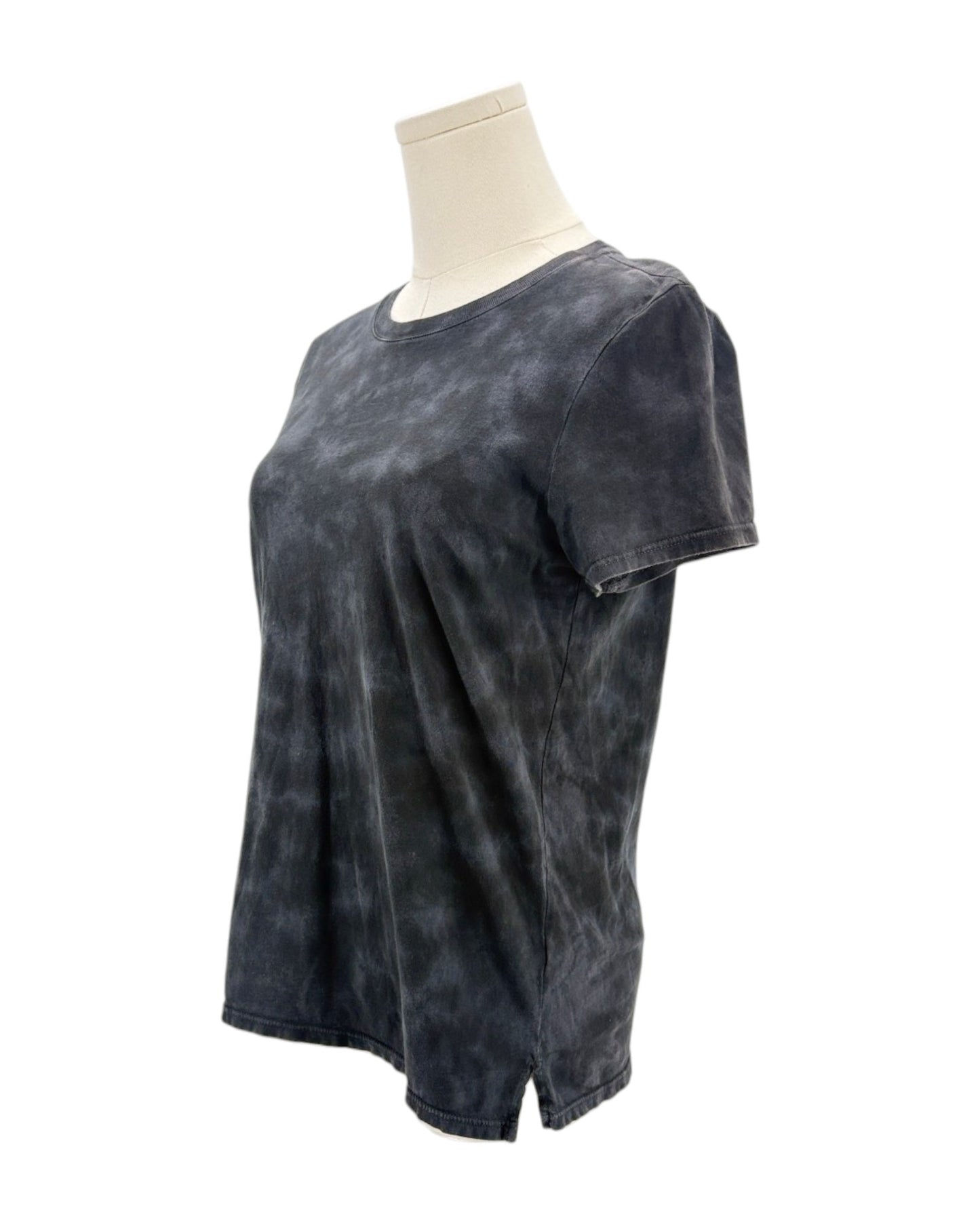 Black tie-dye t-shirt on a mannequin against a white background