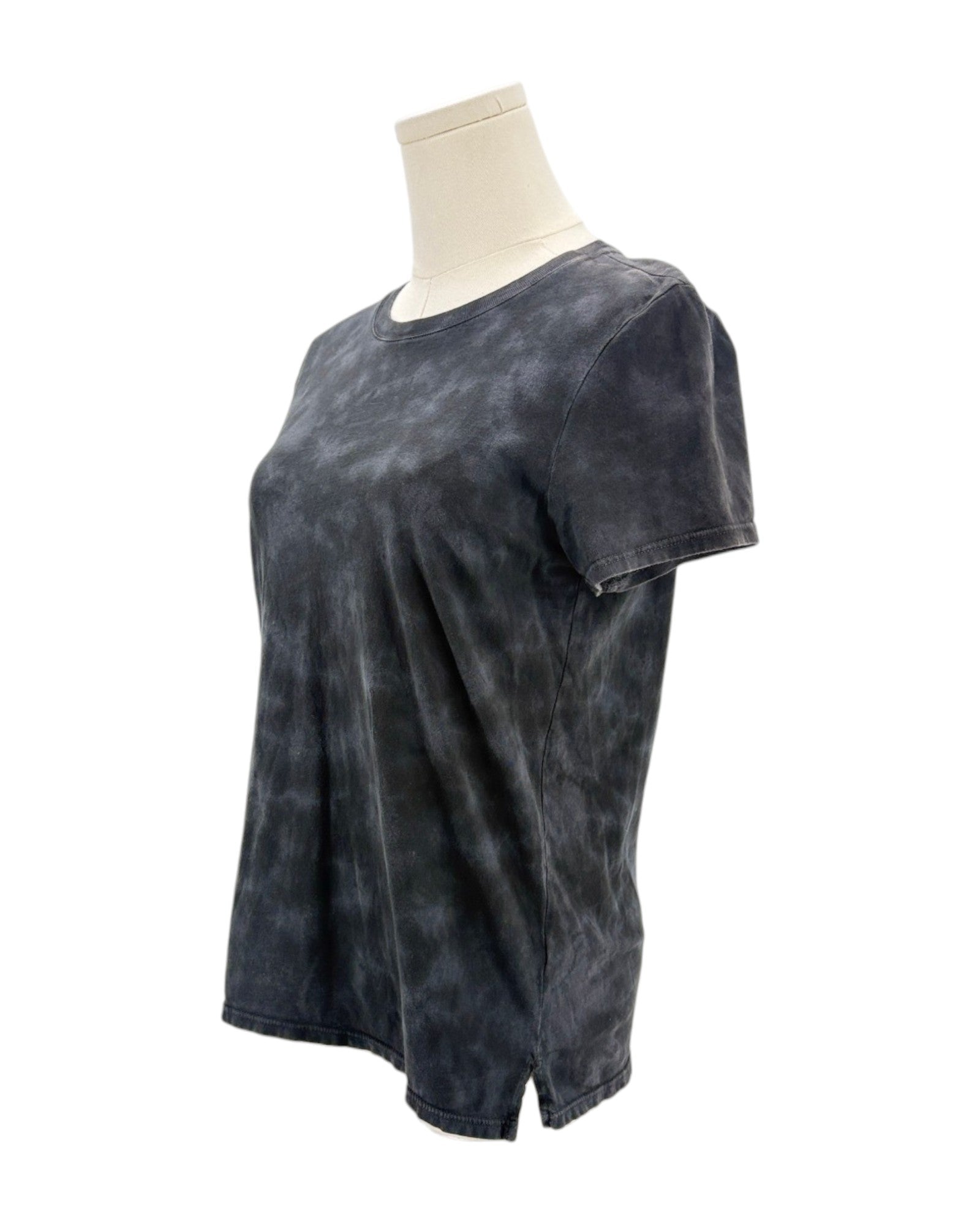 Black tie-dye t-shirt on a mannequin against a white background
