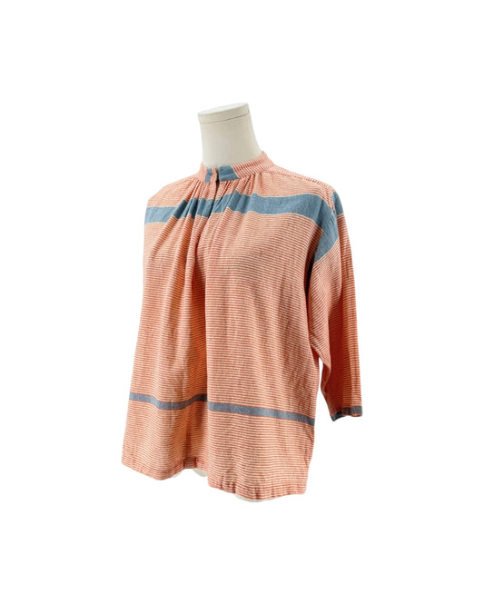 A peach-colored long-sleeve blouse with blue horizontal stripes, displayed on a mannequin torso against a white background.