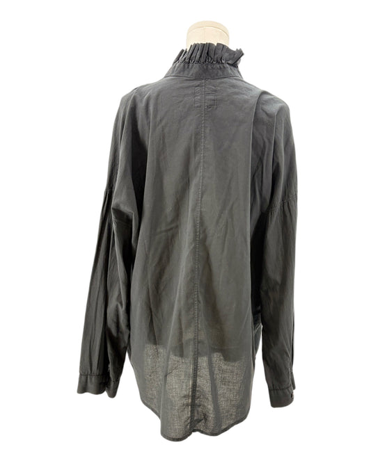 Black blouse on a mannequin against a white background
