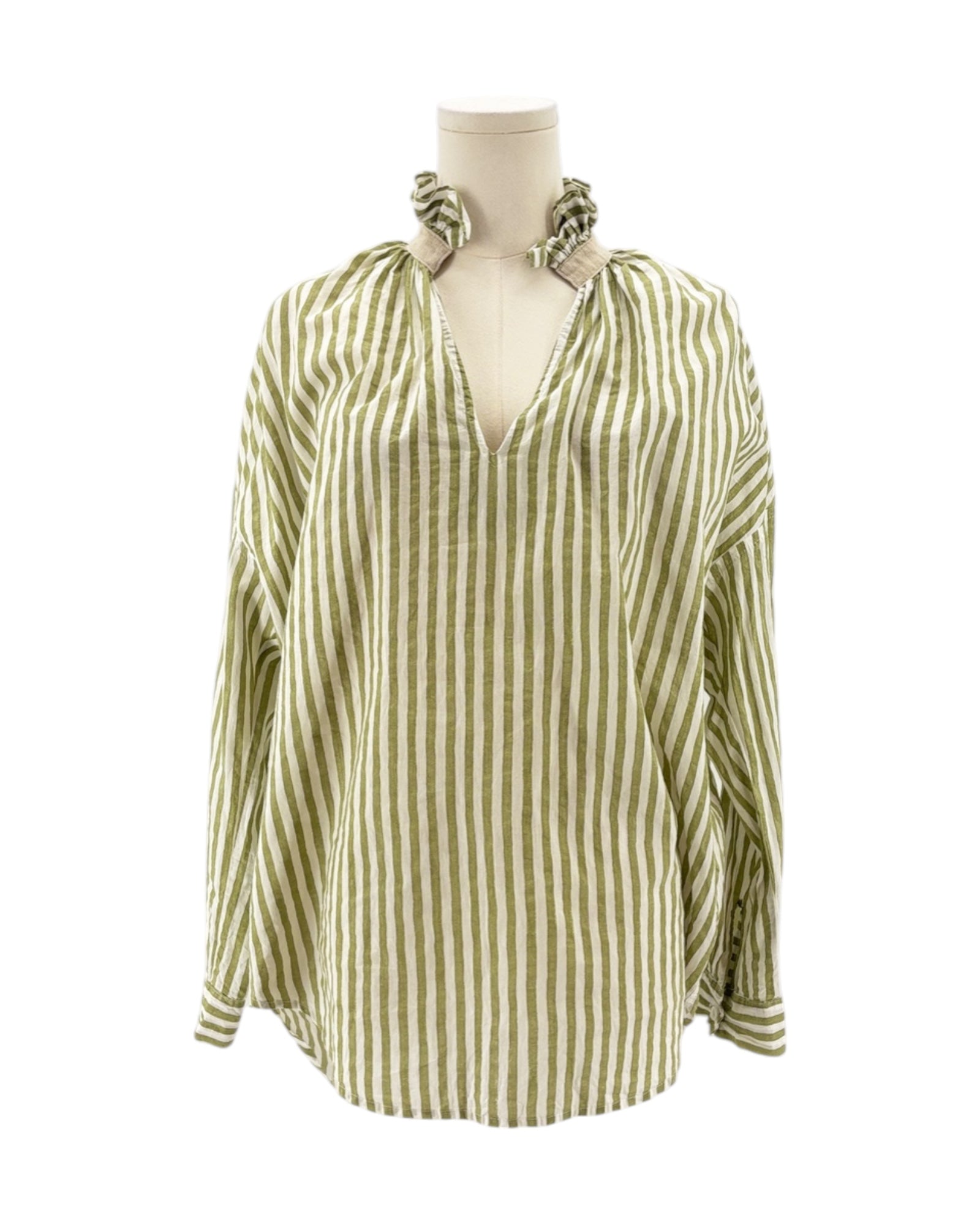 Green and white striped blouse on a mannequin with a white background