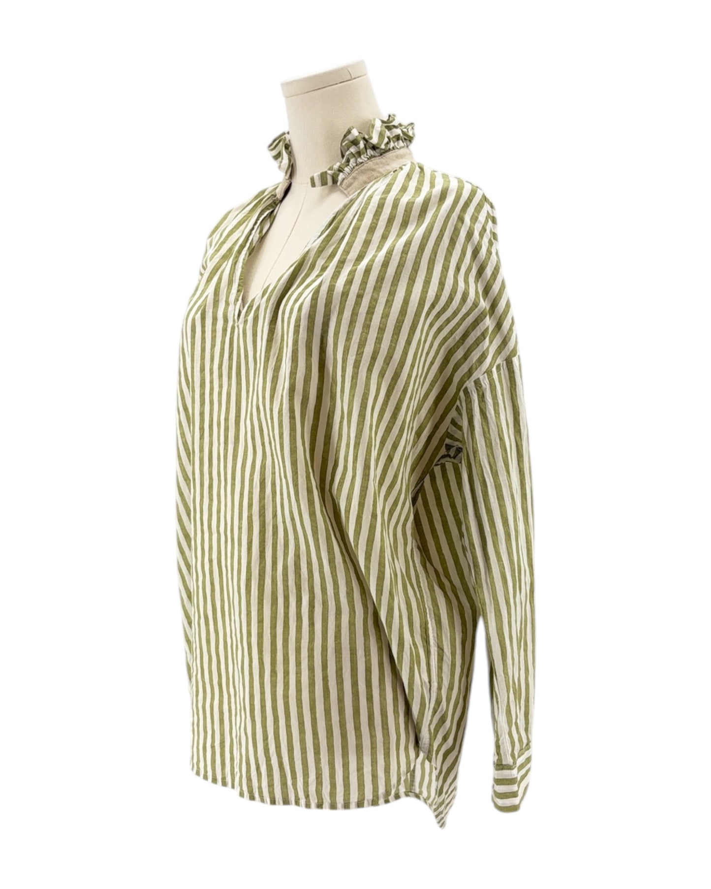 Green and white striped blouse on a mannequin against a white background