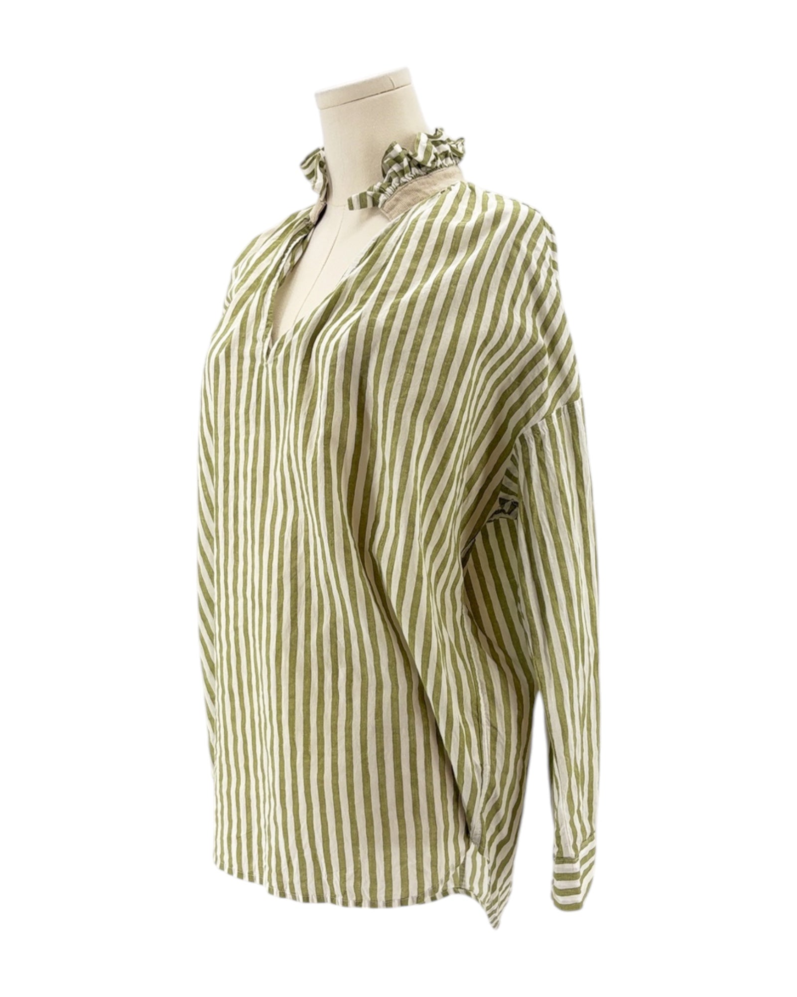 Green and white striped blouse on a mannequin against a white background