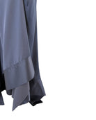 Navy dress with a layered skirt on a white background