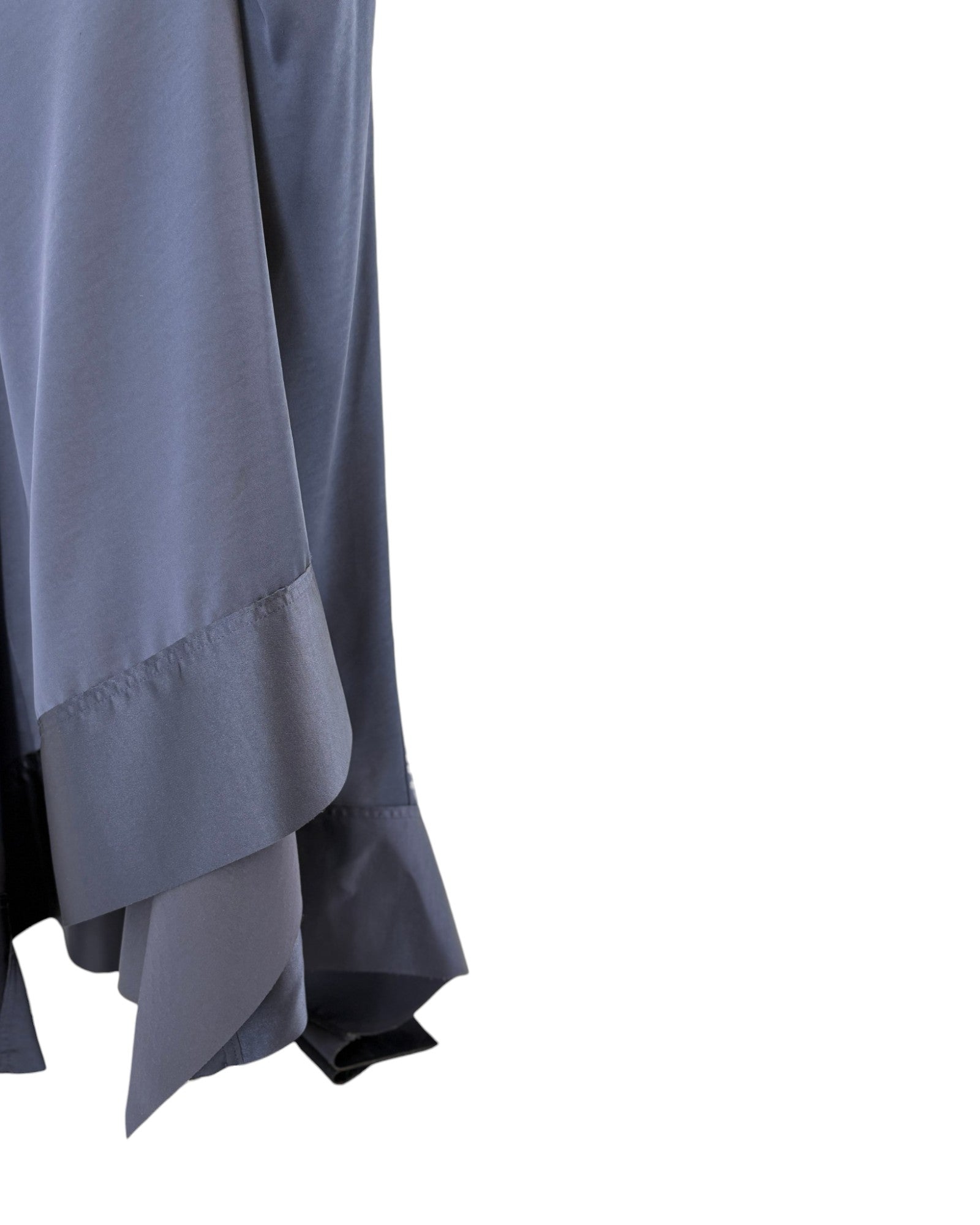 Navy dress with a layered skirt on a white background