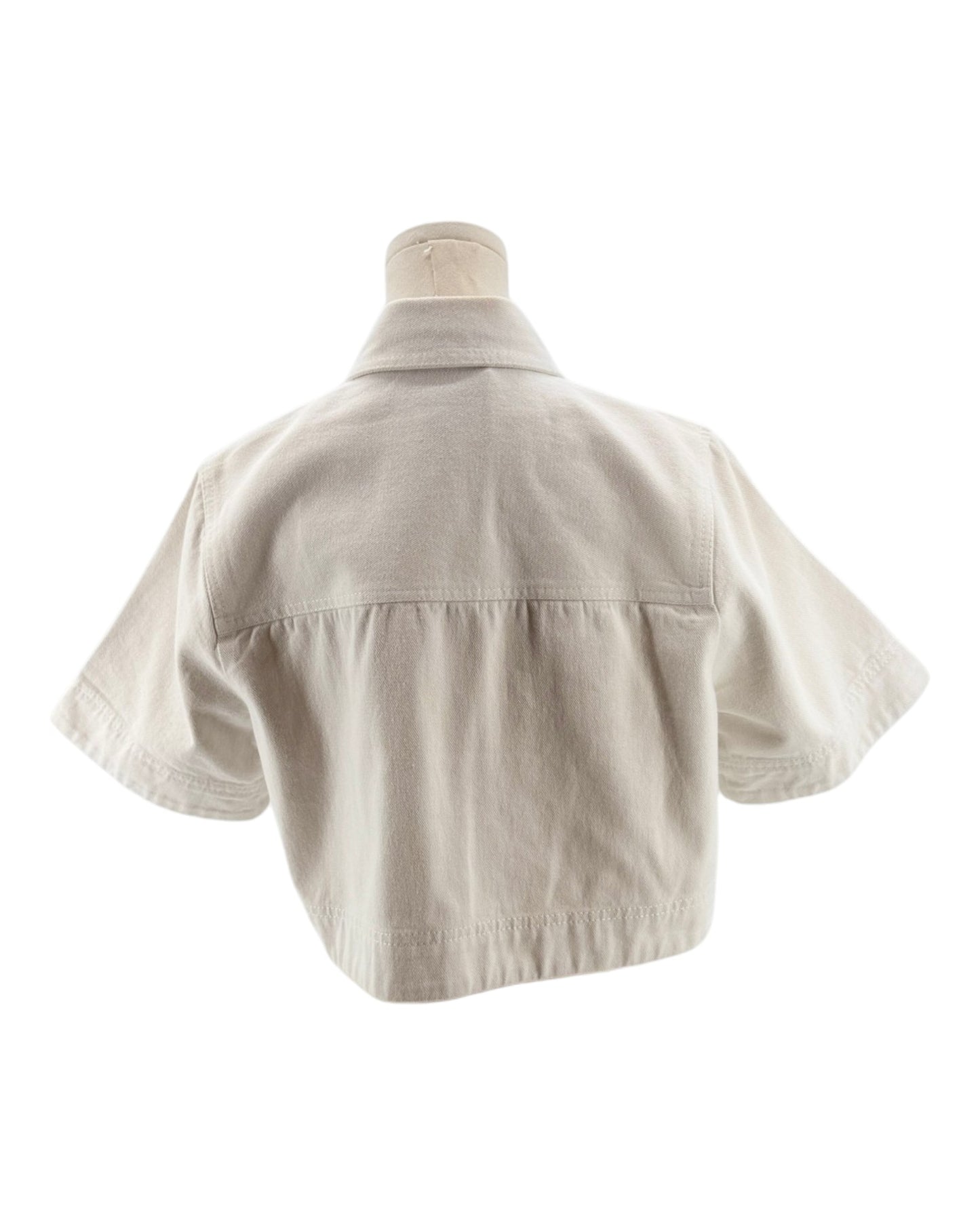 Beige jacket on a mannequin against a white background