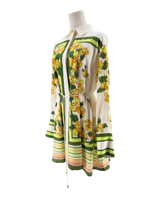 Mannequin wearing a floral patterned dress on a white background